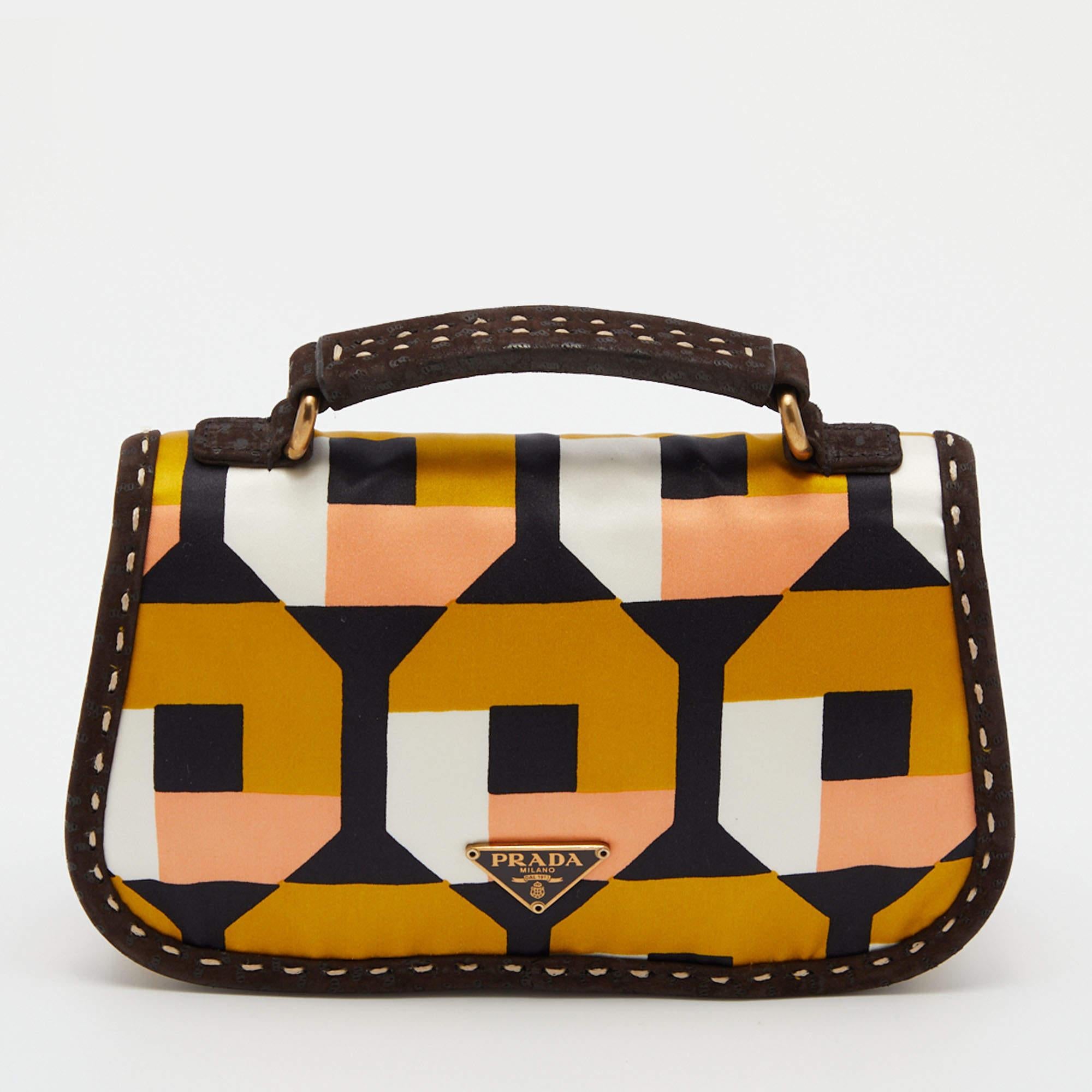 A cute little Prada pochette in printed satin & suede to add that little extra luxury to your ensemble. It is a super mini bag that you can parade using the top handle.

Includes: Original Dustbag, Info Booklet, Pocket Mirror, Authenticity Card

