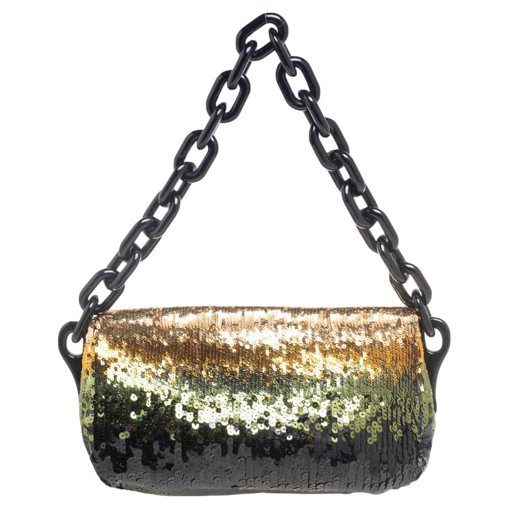 Sequins and gold-tone hardware complement this Prada shoulder bag beautifully. It has a branded lock on the flap and a lined interior for your belongings.

