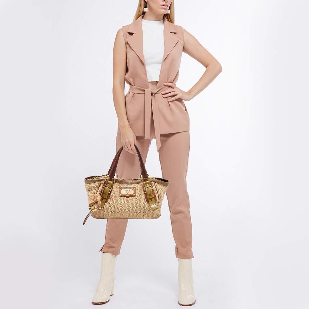 This alluring tote bag for women has been designed to assist you on any day. Convenient to carry and fashionably designed the tote is cut with skill and sewn into a great shape. It is well equipped to be a reliable accessory.