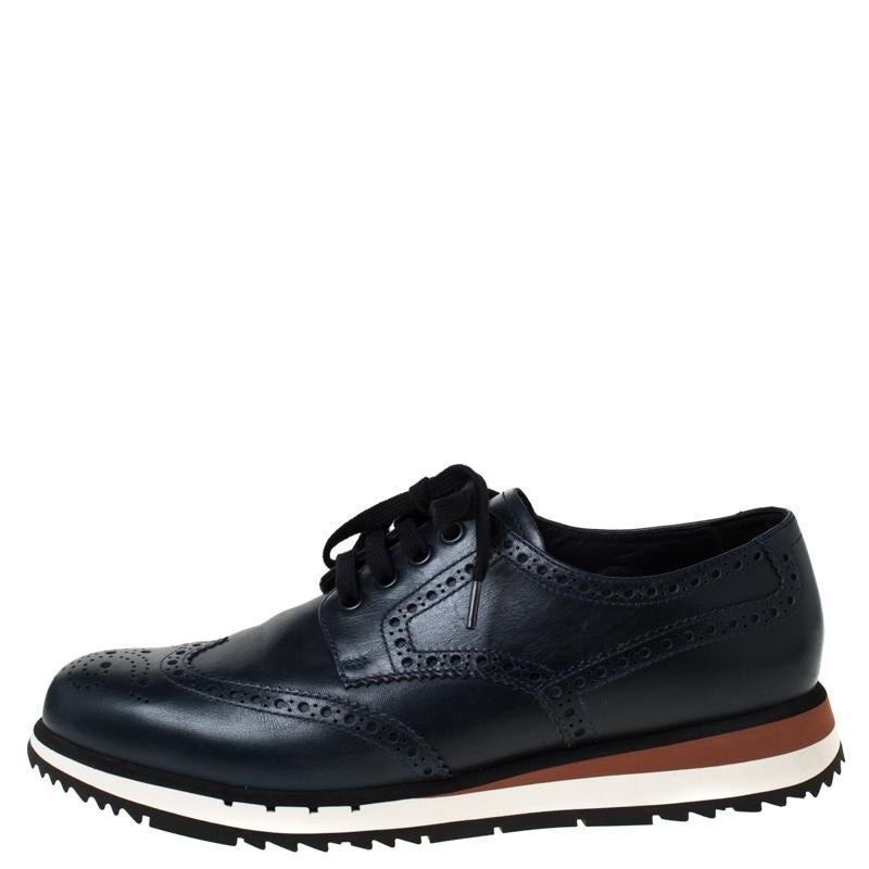 These designer oxfords from Prada are just what you need to pair with a smart formal look. These impressive navy blue oxfords can add a dapper twist to your entire outfit be it any occasion. They are crafted from brogue leather with wingtip