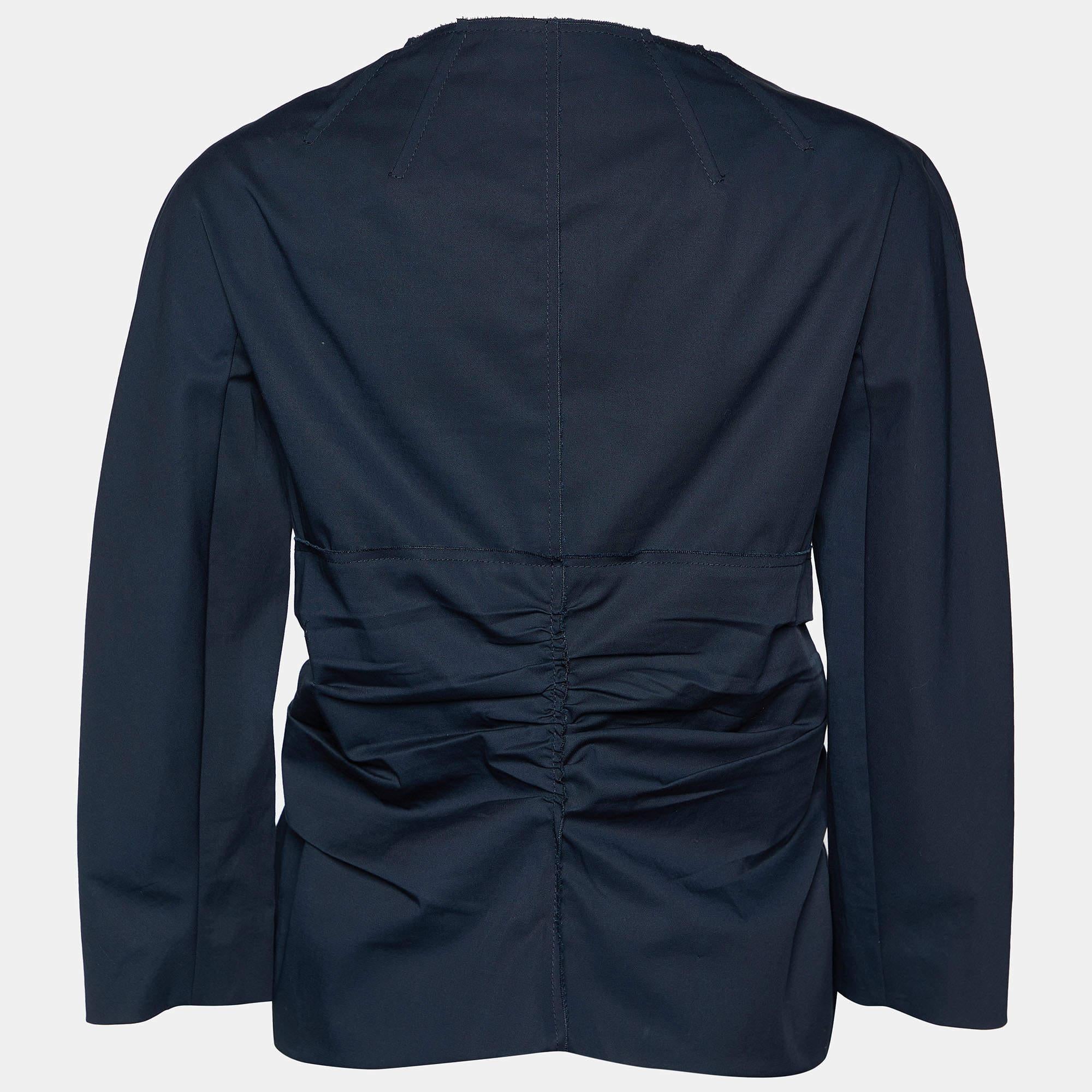 The navy blue shade and the smart shape make this Prada jacket for women a covetable piece. It has long sleeves and draped details. Wear this one for an effortlessly chic look.