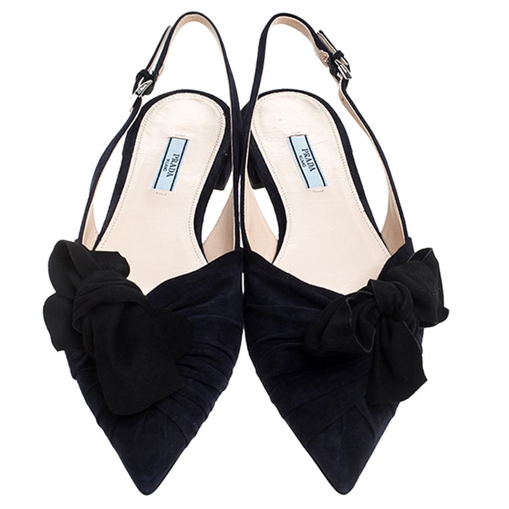 This pair of flat sandals by Prada is lovely. They've been wonderfully crafted from navy blue suede in a design of slingbacks, pointed toes and bow details. Made in a simple style, they will look great on your feet.

Includes: Original Dustbag,