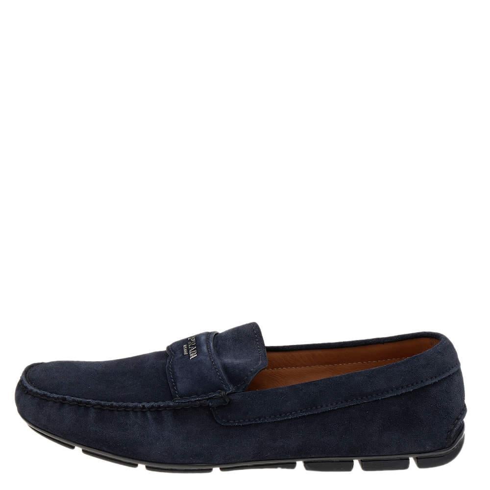 Let comfort and classic style be yours with these designer loafers from Prada. Crafted in navy blue suede, the high-quality shoes have the perfect construction to take you through the day with utmost ease.

