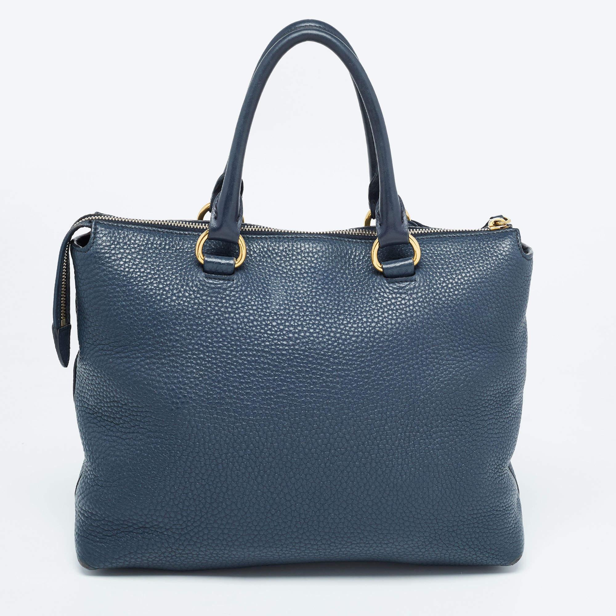 This stylish satchel has been crafted from fine materials. It opens to a capacious interior that can easily hold your everyday essentials. Swing it with style!

Includes: Authenticity Card, Info Booklet, Detachable Strap

