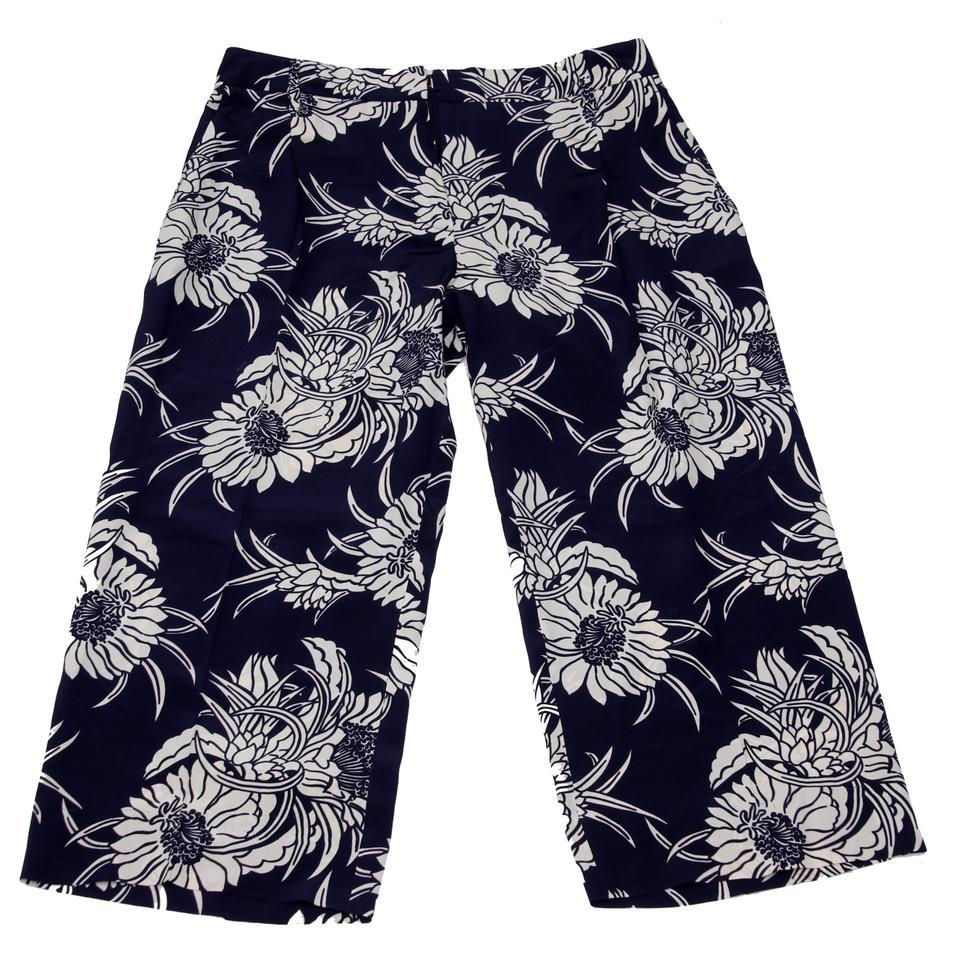 Prada Navy Blue White Floral Pattern Print Silk Casual Pants Capris

These Prada floral pants are crafted out of pure silk in blue and white pattern. Silk capri trousers are a trendy statement piece that ensure utmost comfort with wear. Wear them to