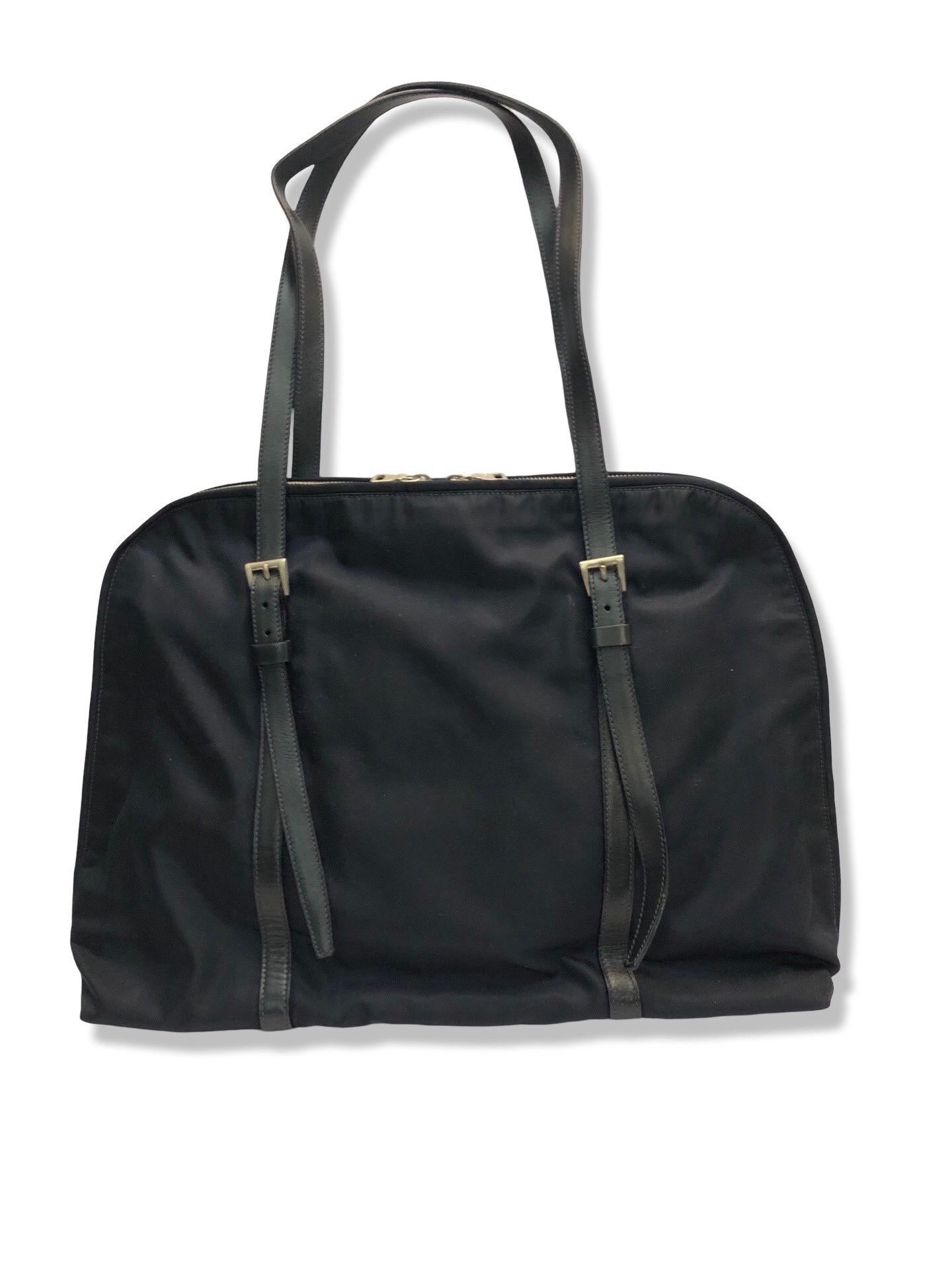 - Prada navy dark blue nylon with two adjustable shoulder straps handle bag circa from the 90s era. 

 - Featuring a two sides zipper closure. 

- One interior zip pocket closure. 

- Prada navy blue interior lining throughout. 

- Condition: A bit