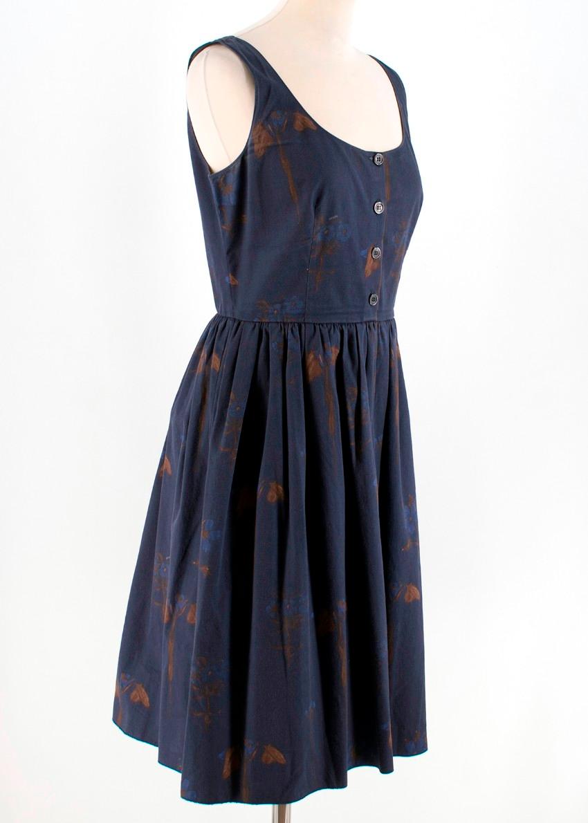 Prada Navy Floral Print Dress

- Navy, lightweight, floral print dress
- Scoop neck
- Slim shoulder straps
- Centre-front half-way button fastening
- Ruched waist, flared skirt
- Zip fastening on the left side 
- 98% cotton, 2% elastane 

Please