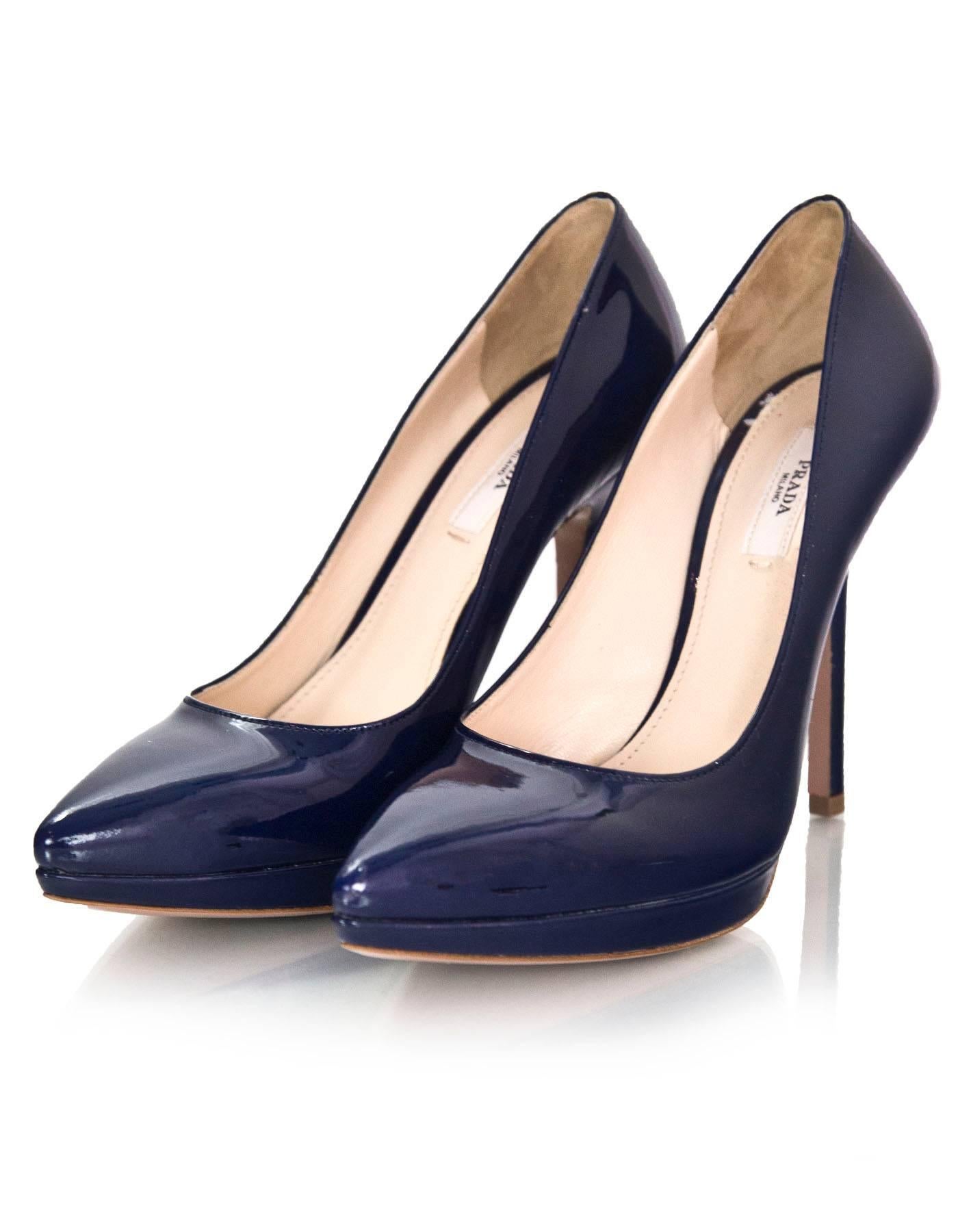 Prada Navy Patent Leather Vernice Donna Pumps Sz 37.5

Made In: Italy
Color: Navy
Materials: Patent leather
Closure/Opening: Slide on
Sole Stamp: Prada 37.5 Made in Italy
Overall Condition: Very good pre-owned condition with the exception of peeling