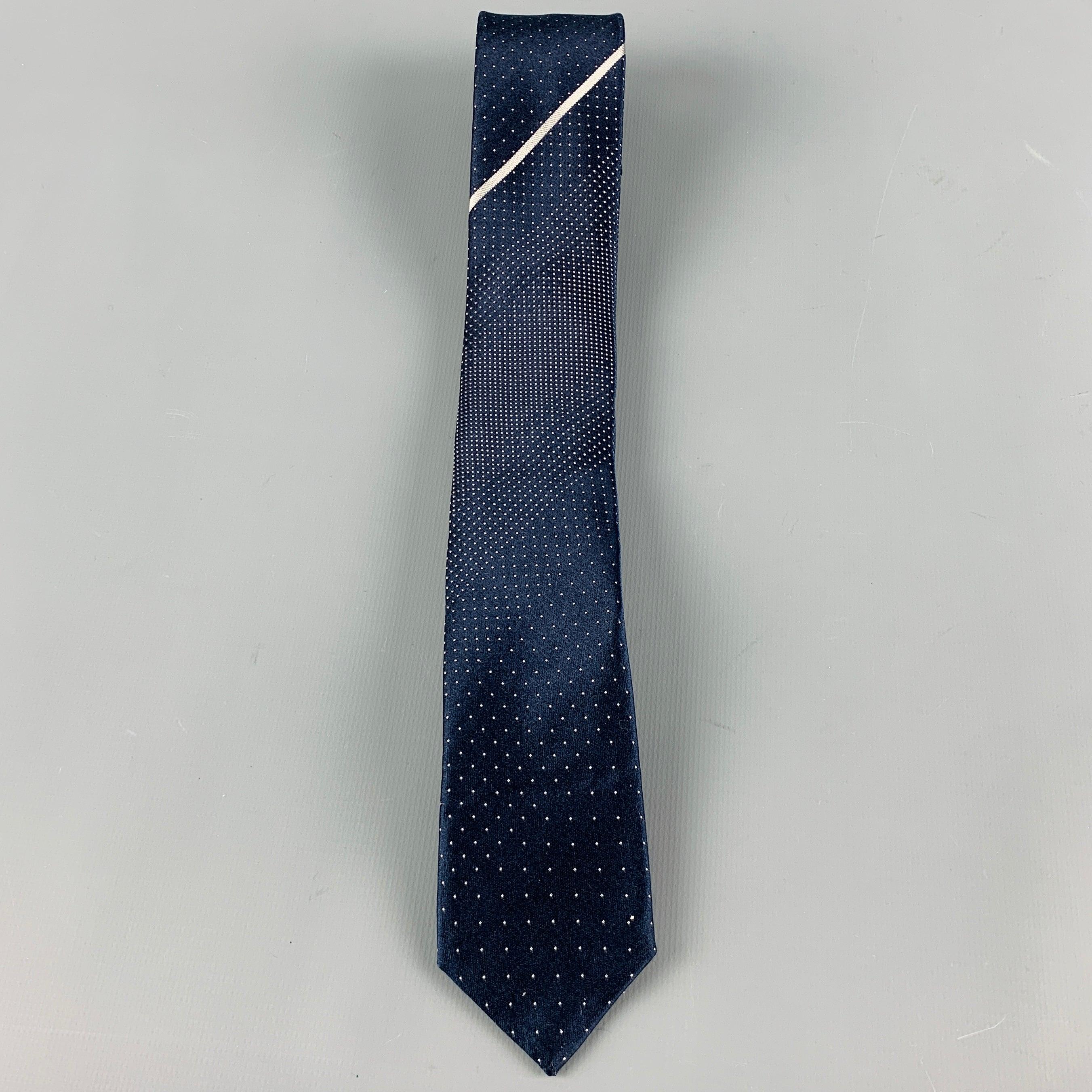 PRADA
necktie in a navy silk satin fabric featuring white dots pattern and narrow style. Made in Italy.Excellent Pre-Owned Condition. 

Measurements: 
  Width: 2 inches Length: 60 inches 
  
  
 
Reference No.: 128739
Category: Tie
More Details
   