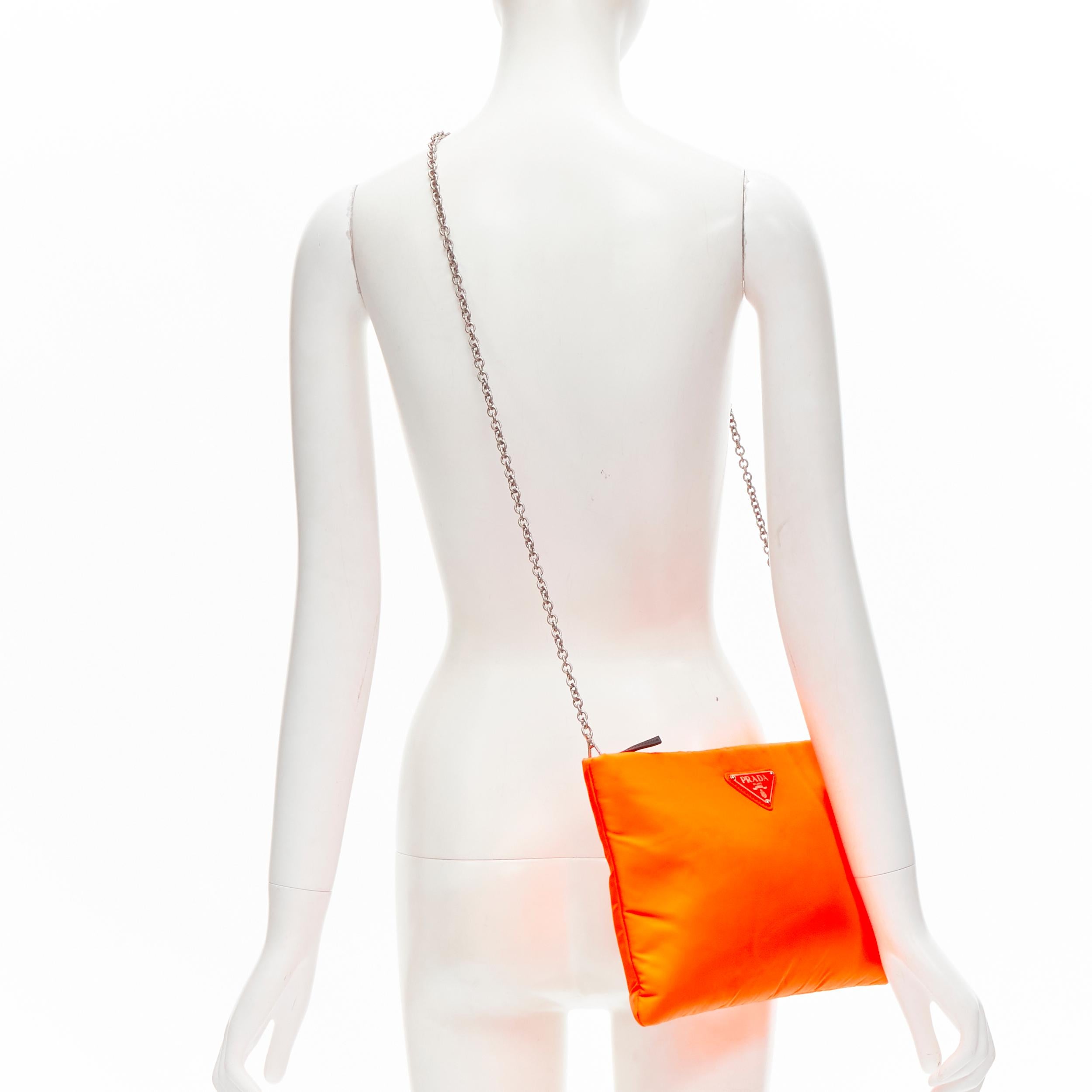 PRADA neon orange Vitello nylon triangle logo chain crossbody clutch bag 
Reference: ANWU/A00028 
Brand: Prada 
Designer: Miuccia Prada 
Material: Nylon 
Color: Orange 
Pattern: Solid 
Closure: Zip 
Extra Detail: Detachable shoulder chain in