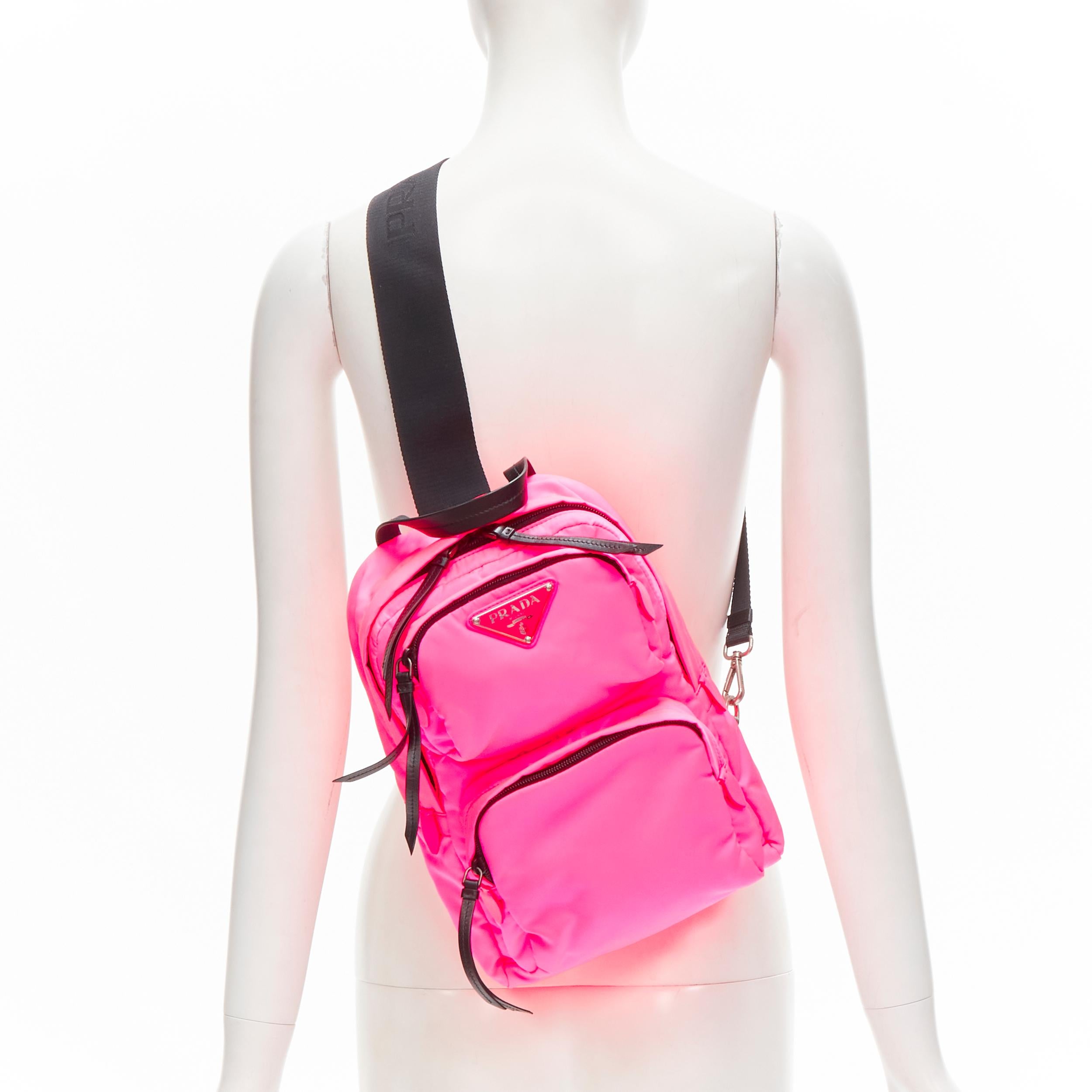 PRADA neon pink Tessuto nylon triangle logo small sling backpack bag
Reference: TGAS/C01230
Brand: Prada
Designer: Miuccia Prada
Model: Tessuto Nylon
Material: Nylon
Color: Pink, Black
Pattern: Solid
Closure: Zip
Lining: Fabric
Extra Details: