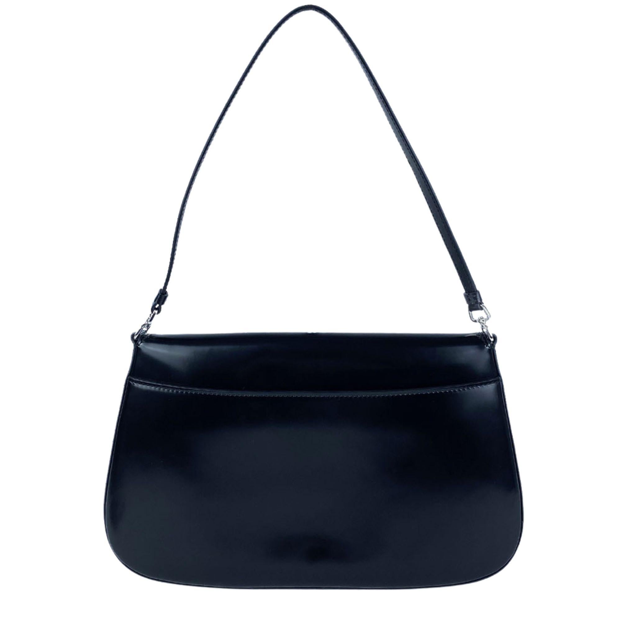 Prada New Black Brushed Leather Cleo Flap Shoulder Bag.  Silver hardware. Prada logo plaque at front flap. Open to a leather canvas interior with large side pocket. Perfect bag for day or night.

Material: Leather
Hardware: Silver