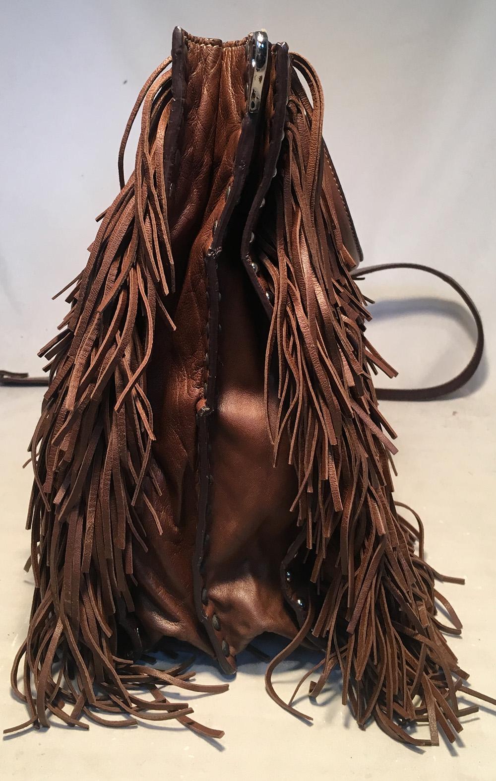 PRADA Noce Nappa Brown Leather Fringe Tote Bag in excellent condition. Soft and supple brown leather fringe exterior trimmed with silver hardware and studs along edges. Top handles for easy carrying and removable shoulder strap to easily convert