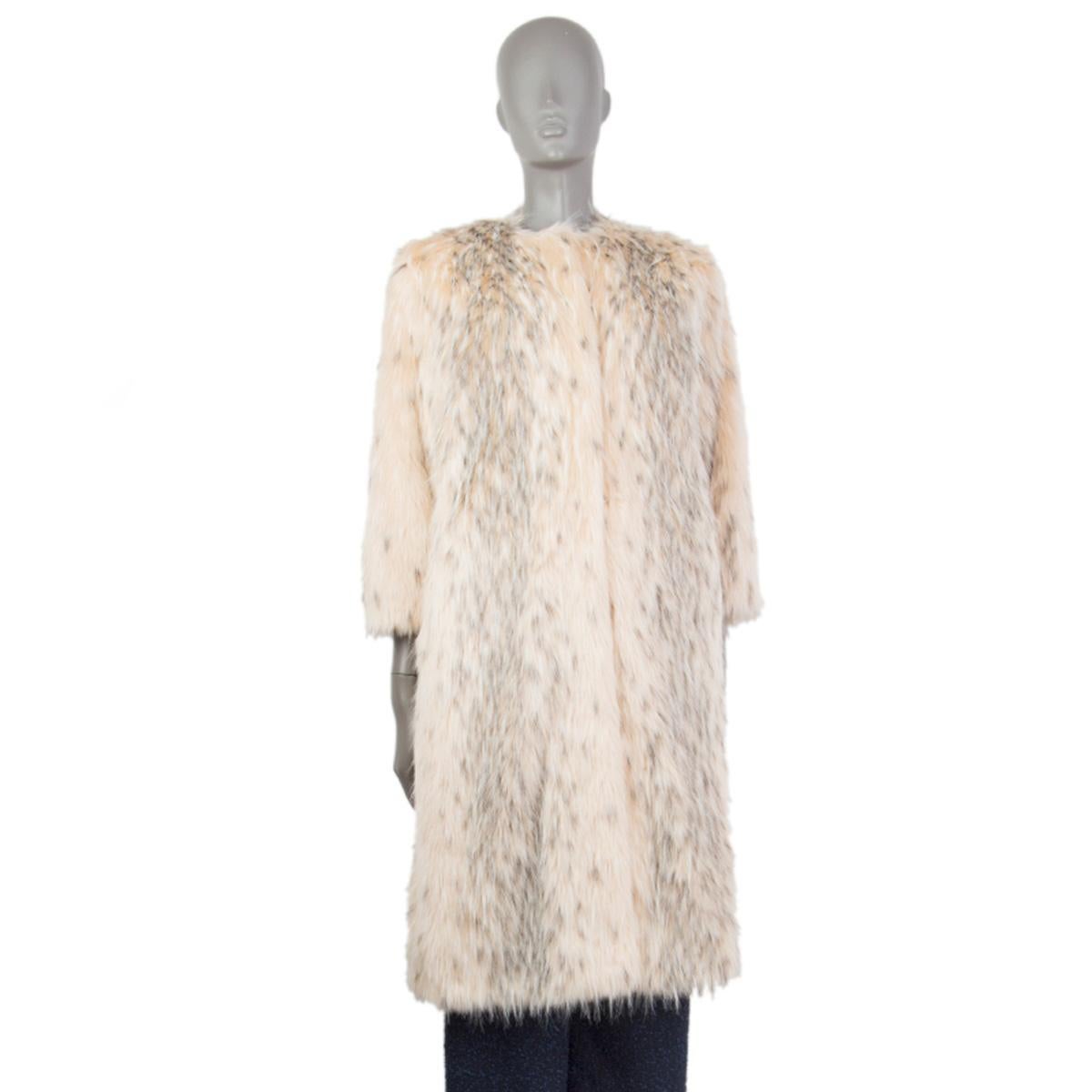 100% authentic Prada collarless faux fur coat in light nude-beige, grey, and white modacrylic (100%). With two slit pockets on the sides. Closes with concealed hooks on the front. Lined in off-white viscose (60%) and silk (40%). Has been worn and is
