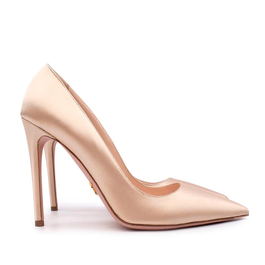 Prada Nude Satin Pointed Toe Heeled Pumps
 

 - Nude tone satin upper, classic point toe
 - Set on a high stiletto heel 
 - Beige leather lining 
 

 Materials:
 Leather
 

 Made in Italy
 

 PLEASE NOTE, THESE ITEMS ARE PRE-OWNED AND MAY SHOW SIGNS