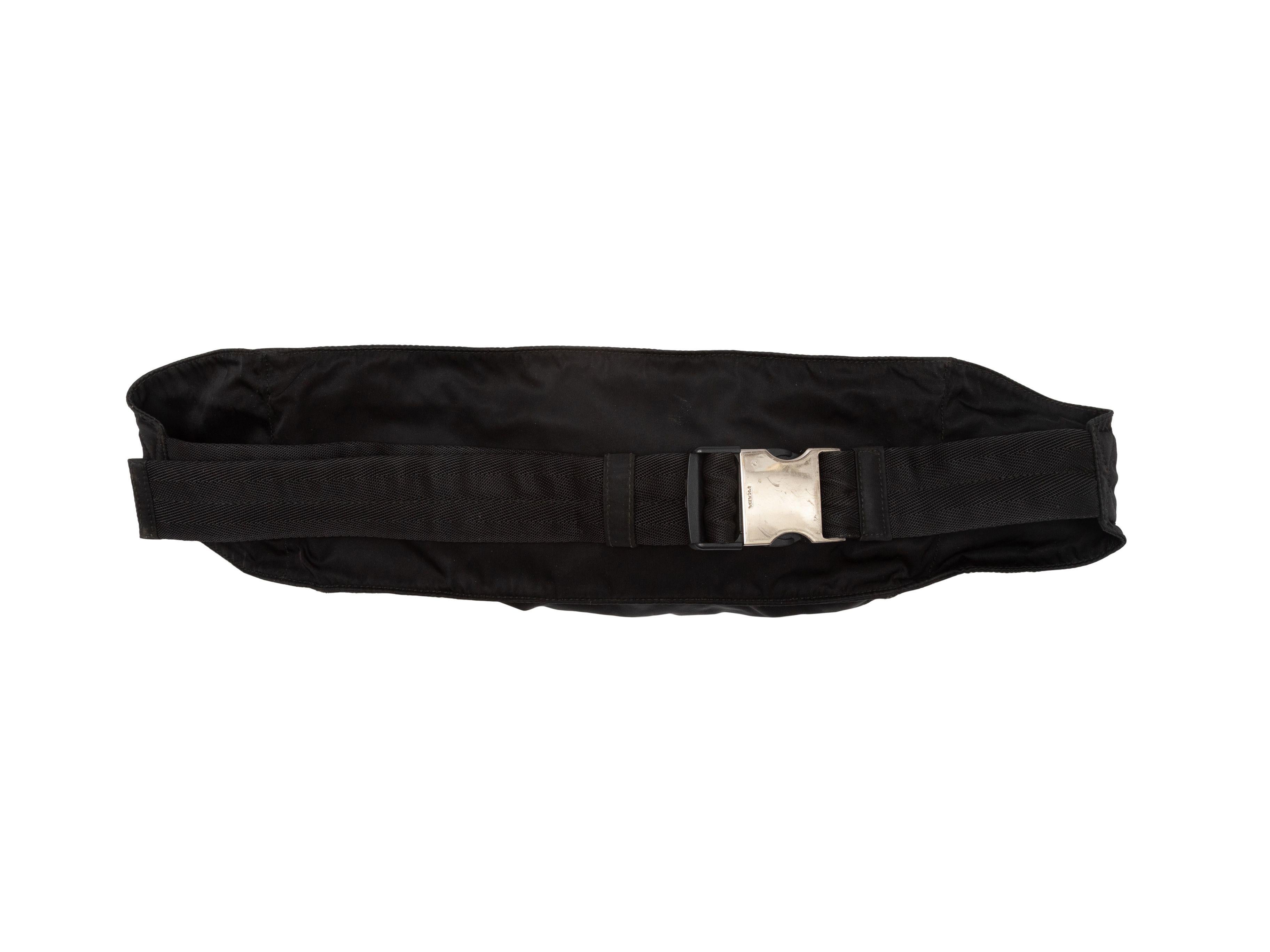 Product Details: Black Prada Nylon Waist Bag. This bag features a nylon body, dual front zip pockets, and a silver-tone buckle closure. 15