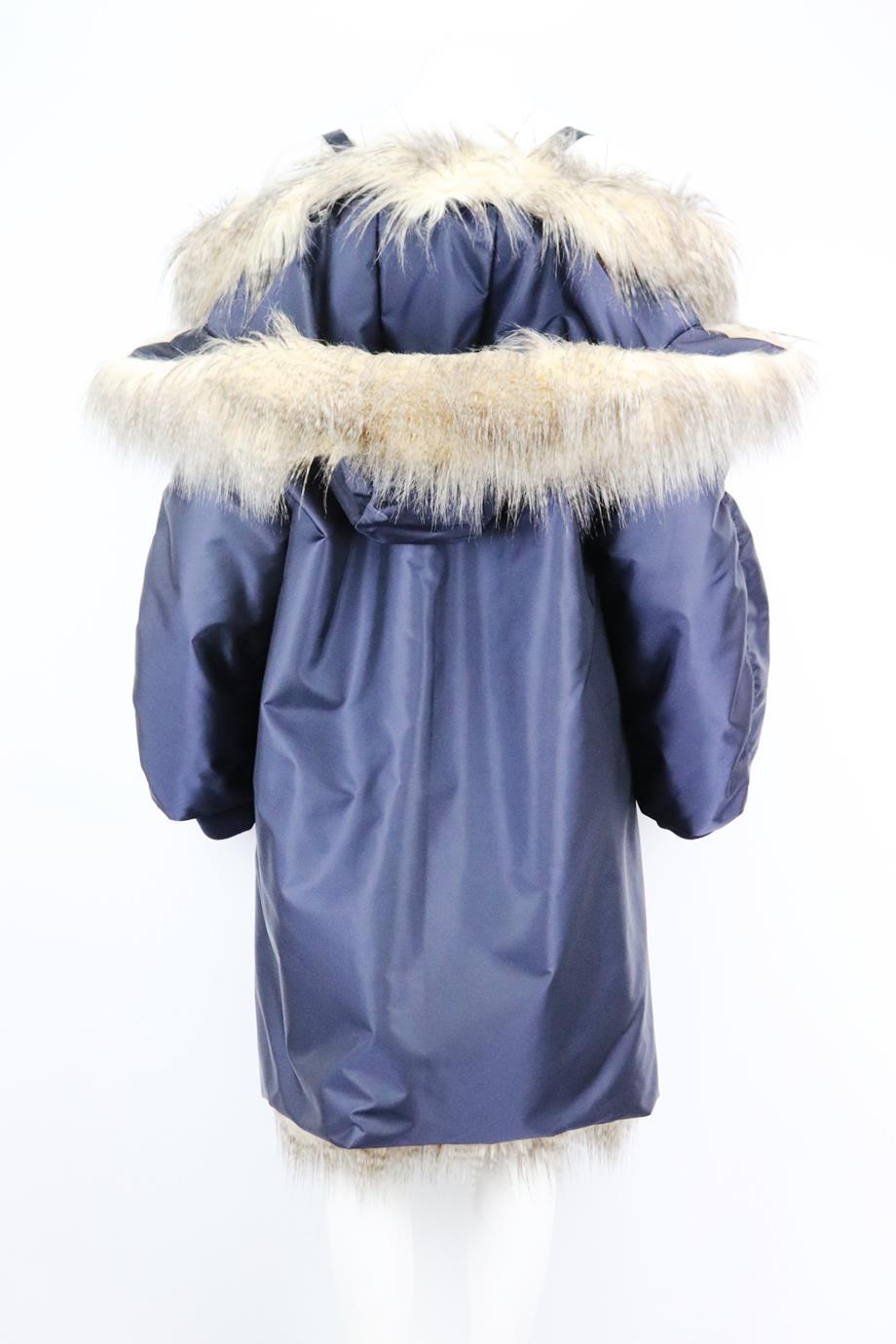 This reversible ‘Re-Nylon’ coat by Prada tows the line between contemporary and classic, it’s lined and trimmed with tactile faux fur on one side, it can be manipulated to sit off-shoulder and secured in-place with fitted backpack straps. Navy