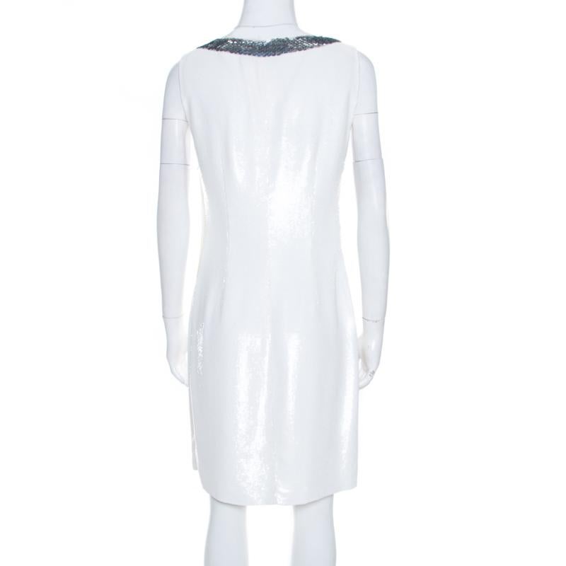 Prada needs no introduction and it doesn't get any classier than this Prada off-white shift dress. Made in silk, it features a sequined neckline and a gleaming finish. It comes with a zip fastening that assists in offering a flattering fit. The chic