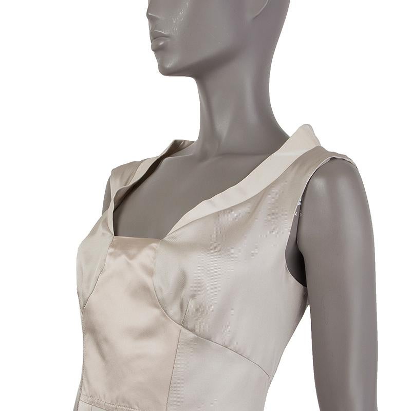 Prada paneled sheath dress in eggshell, pale silver, and champagne wool (57%) and silk (43%). Closes with hook and invisible zipper on the back. Lined in off-white silk organza (100%). Has been worn and is in excellent condition. 

Tag Size 42
Size
