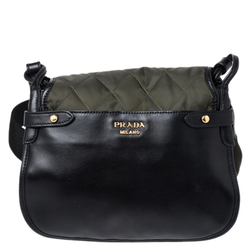 Prada brings you this Passaminiere Hunting shoulder bag that is stylish and functional. Step out in style every time you carry this beauty. Crafted from quality nylon and leather, it flaunts lovely hues of olive green and black. This bag is styled