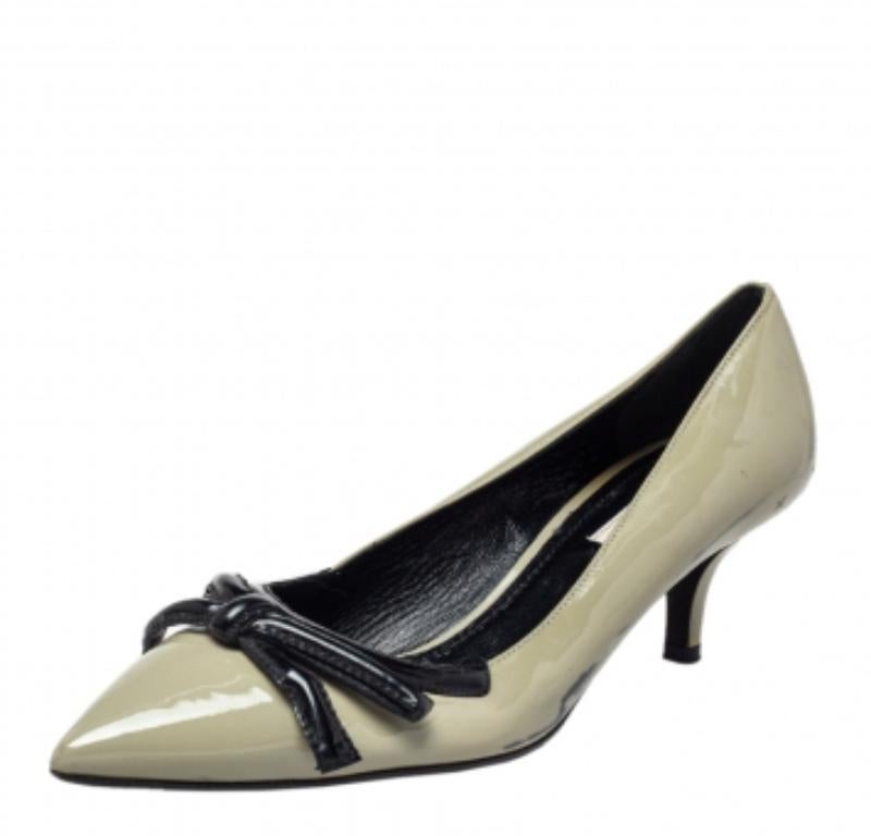 Crafted from well-designed patent leather, this pair of pumps will make you look like a diva. Be a style icon when you add this pair of pumps from the house of Prada to your collection. In a remarkable shade of olive green, this pair is made