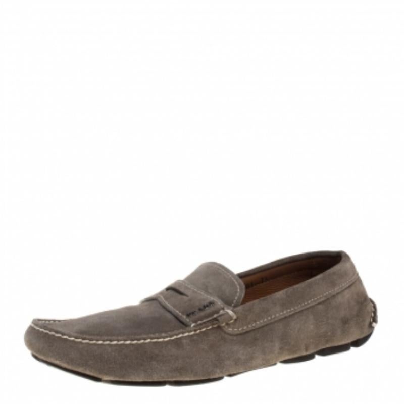 Stylish and super comfortable, this pair of loafers by Prada will make a great addition to your shoe collection. They have been crafted from quality suede and styled with logo detailing in silver-tone on the vamps. Leather insoles and rubber