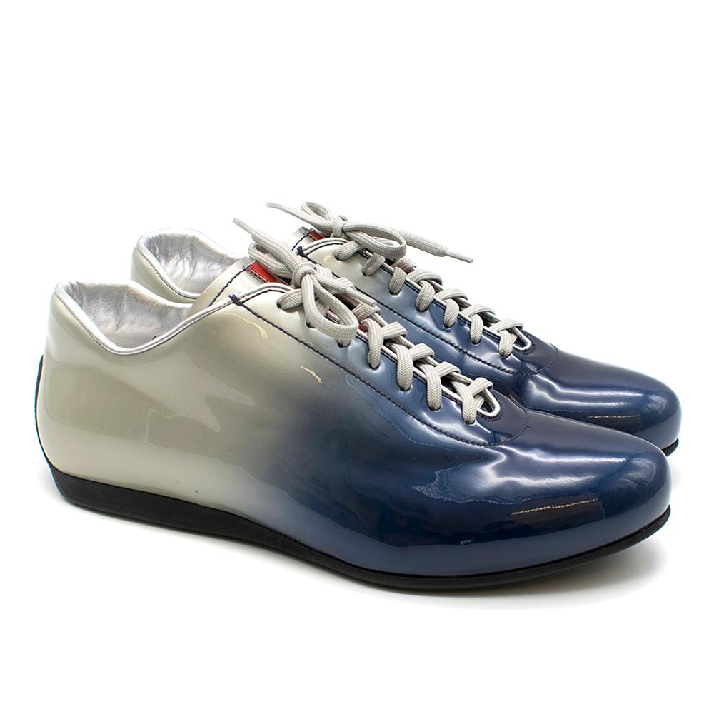 Prada Ombre Blue and Silver Trainers

- Grey laces in good condition
- Prada logo in red on tongue
- Metallic silver lining on inside
- Smooth rubber sole

Please note, these items are pre-owned and may show signs of being stored even when unworn