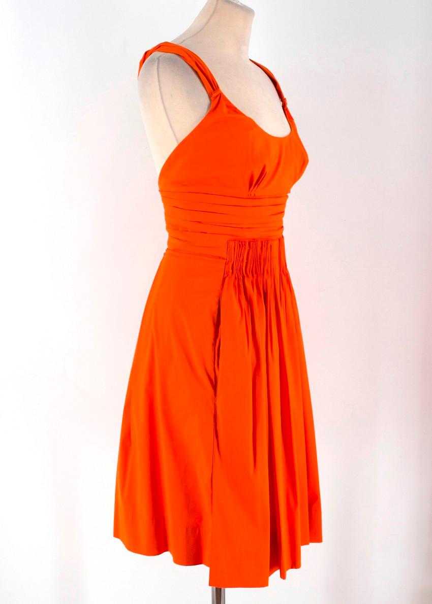 Prada Orange A-line Pleated Dress

-Orange dress with pleated details around the bust and waist
-Zip closure
-Twisted straps
-A line skirt

Please note, these items are pre-owned and may show signs of being stored even when unworn and unused. This
