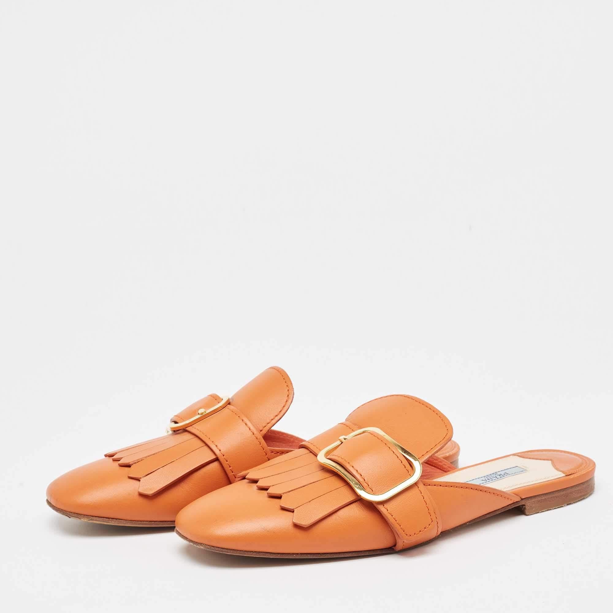 Frame your feet with these Prada flat mules. Created using the best materials the flats are perfect with short midi and maxi hemlines.
