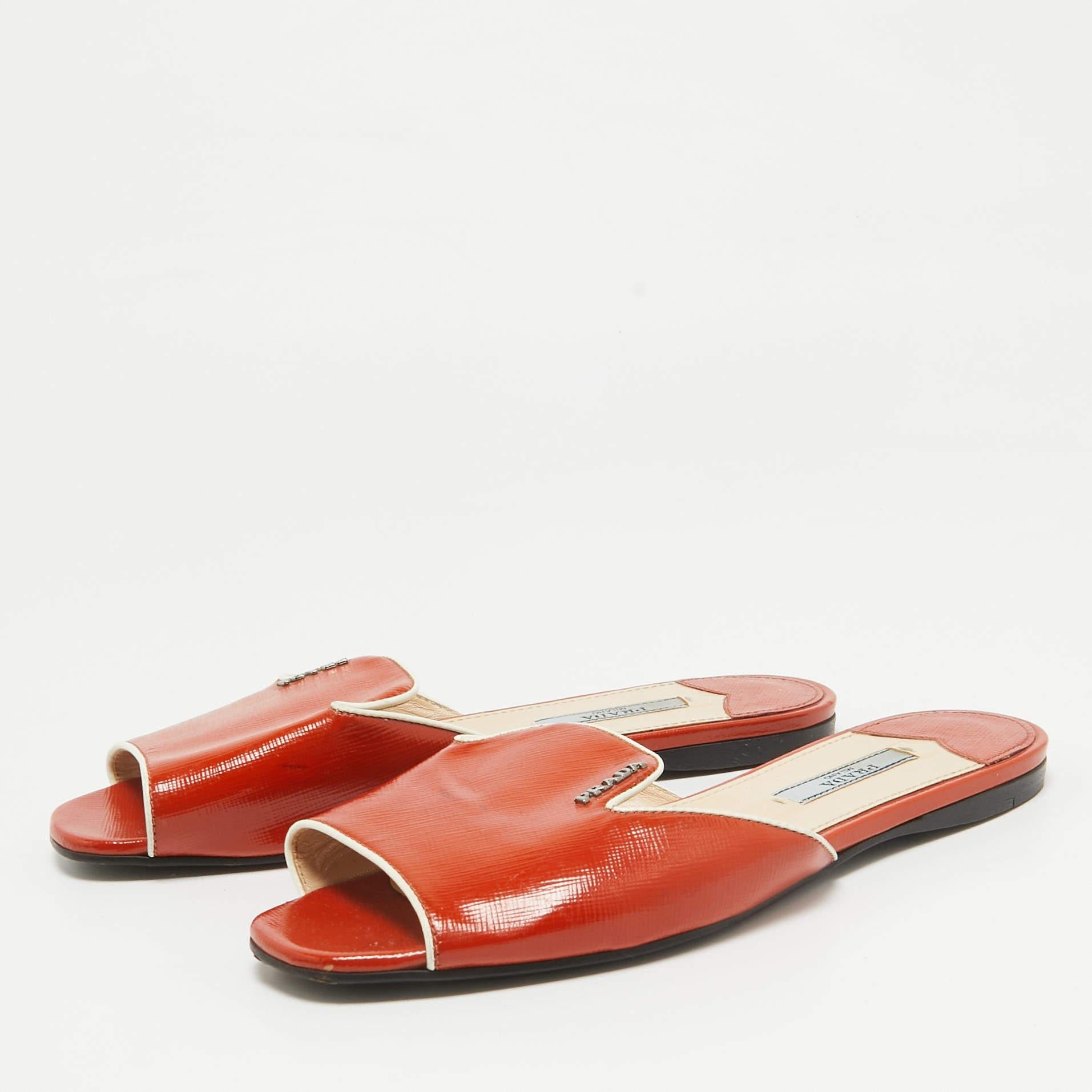Enhance your casual looks with a touch of high style with these designer slides. Rendered in quality material with a lovely hue adorning its expanse  this pair is a must have