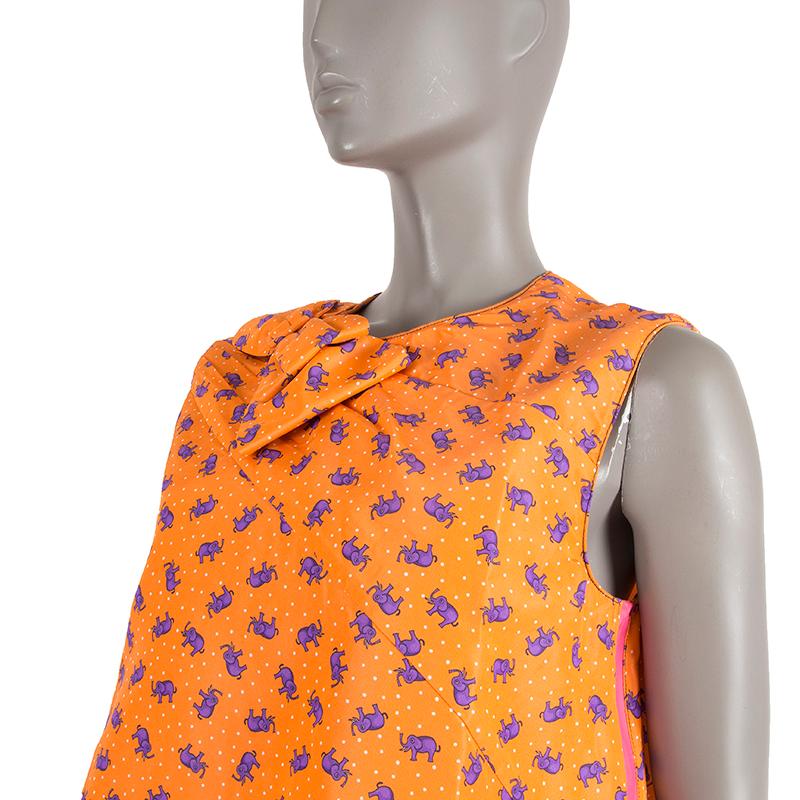 Prada SS'17 elephants tent dress in orange, purple, pink, and white silk (100%). With pleats from the right shoulder, drawstring around the hemline and zipper slits on the sides that open all the way up to under the arms. Lined in white nylon