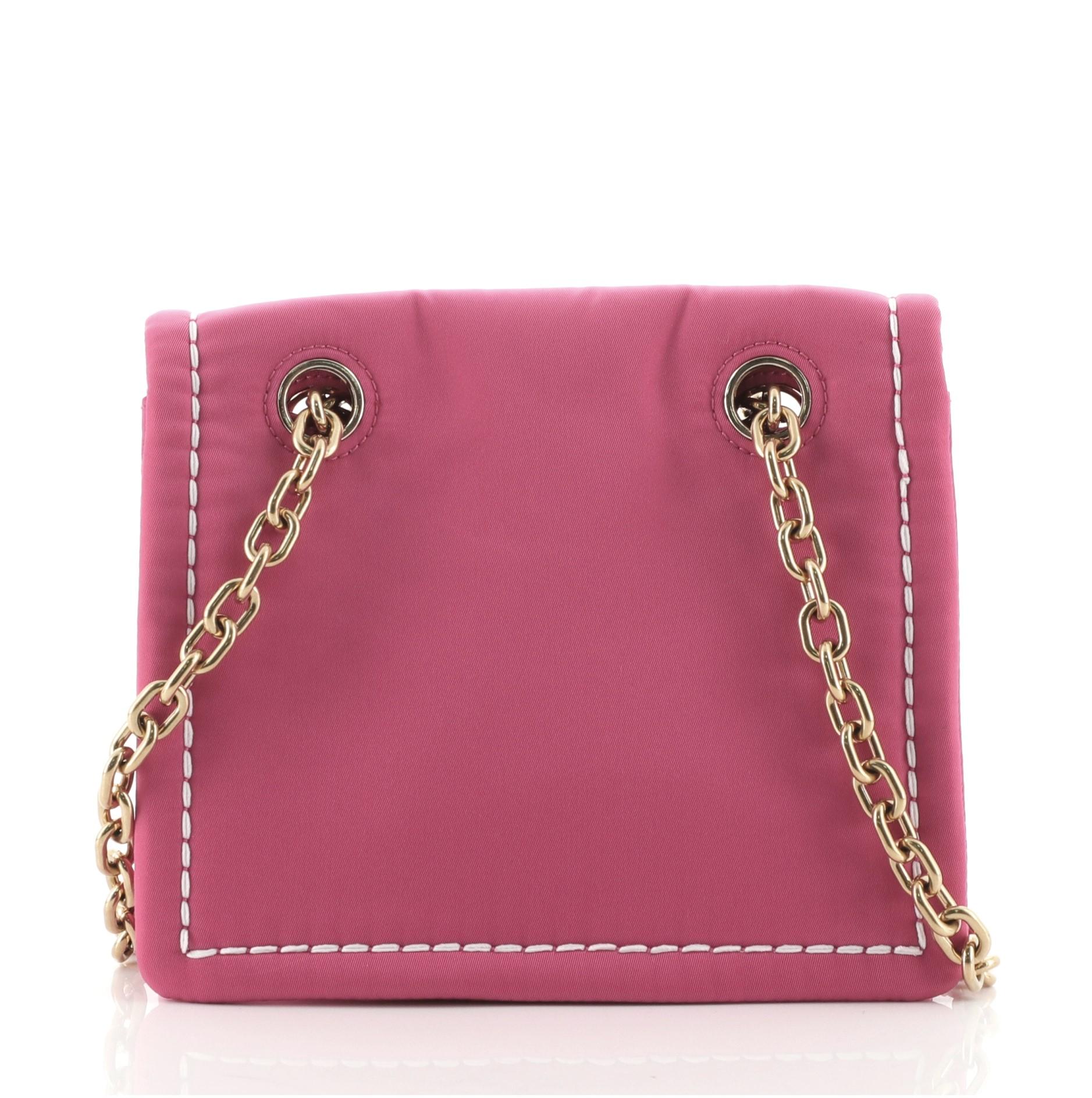 Prada Padded Chain Flap Bag Tessuto Small
Pink

Condition Details: Minor wear on flap edge and in interior base, scratches on hardware.

52141MSC

Height 6.5