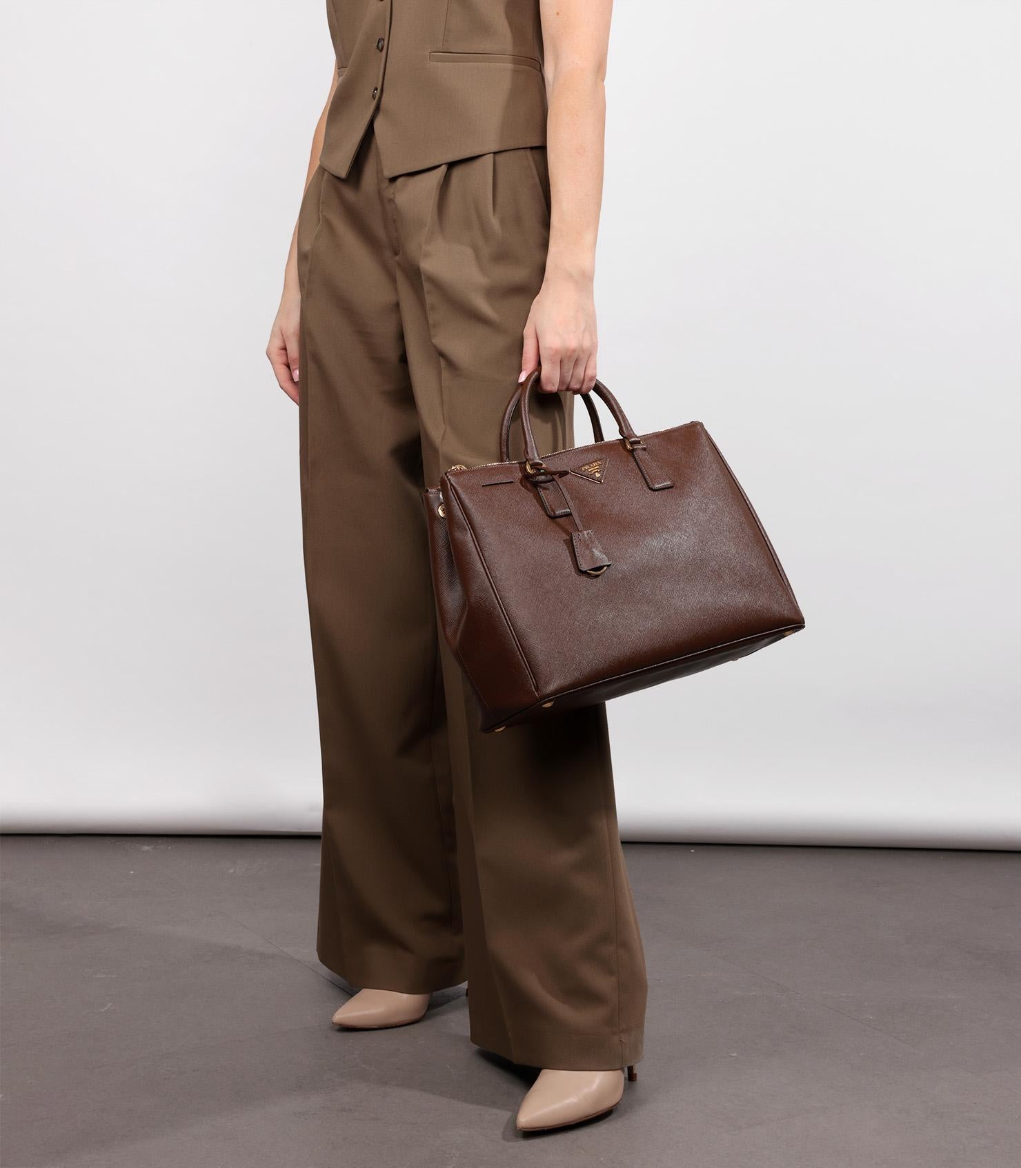 Prada Palissandro Saffiano Lux Leather Large Galleria Tote

Product Details
Xupes Ref: CB1304
Brand: Prada
Model: Large Galleria Tote
Type: Tote
Serial Number: 7
Age: 2014
RRP: £3,700
Accompanied By: Prada Dust Bag, Authenticity Card, Care Booklet,