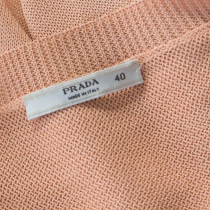 Prada's pullover is a fine combination of subtle style and feminine details. It is tailored in quality fabrics and has a plunging neckline, long sleeves and a loose silhouette. Team it with a variety of bottoms for a fun look.