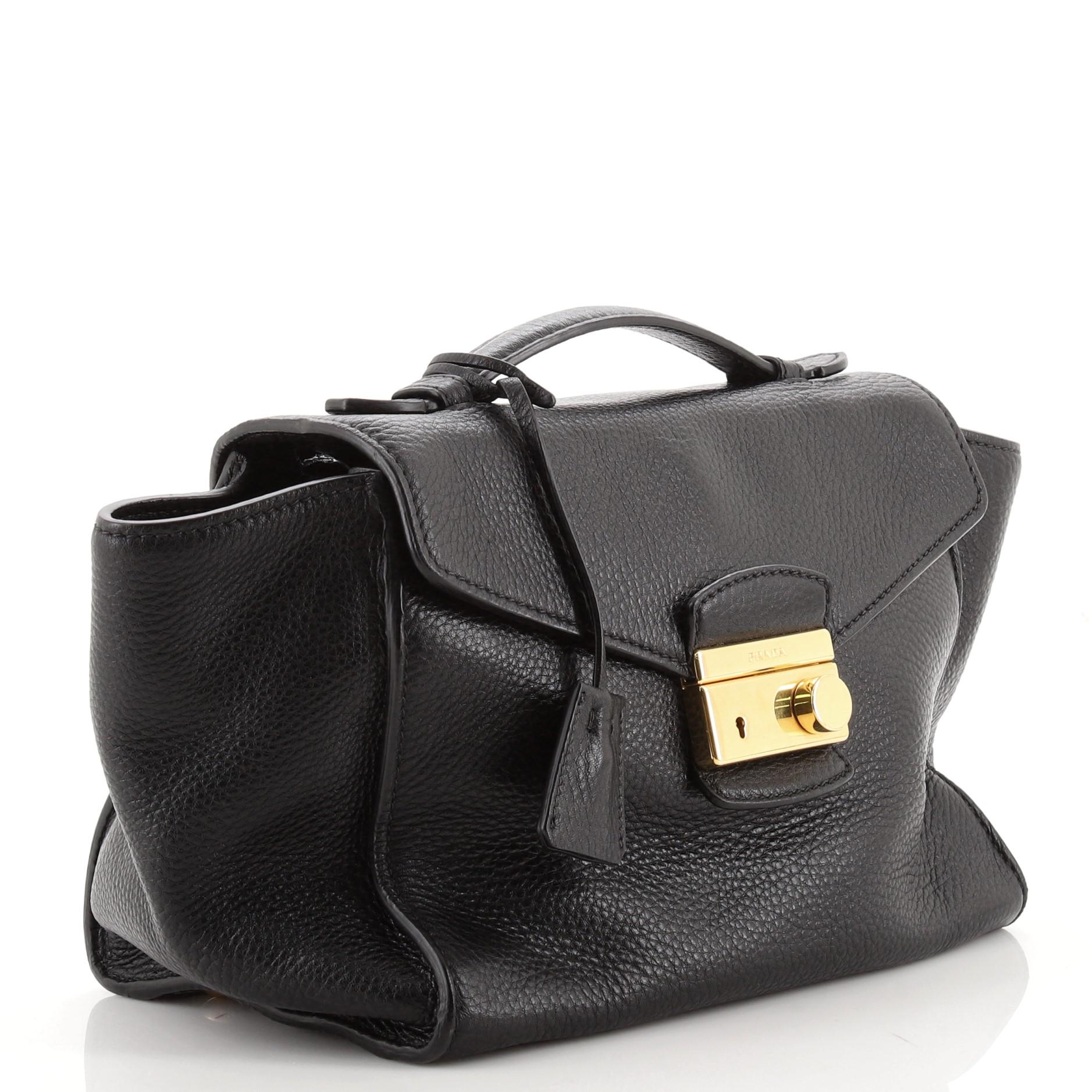 Condition: Good. Loss of shape on exterior, cracking on base, rear pocket corner, side flap and opening wax edges, indentations underneath flap. Wear on side pocket opening trims, scratches and discoloration on hardware.
Accessories: Keys,