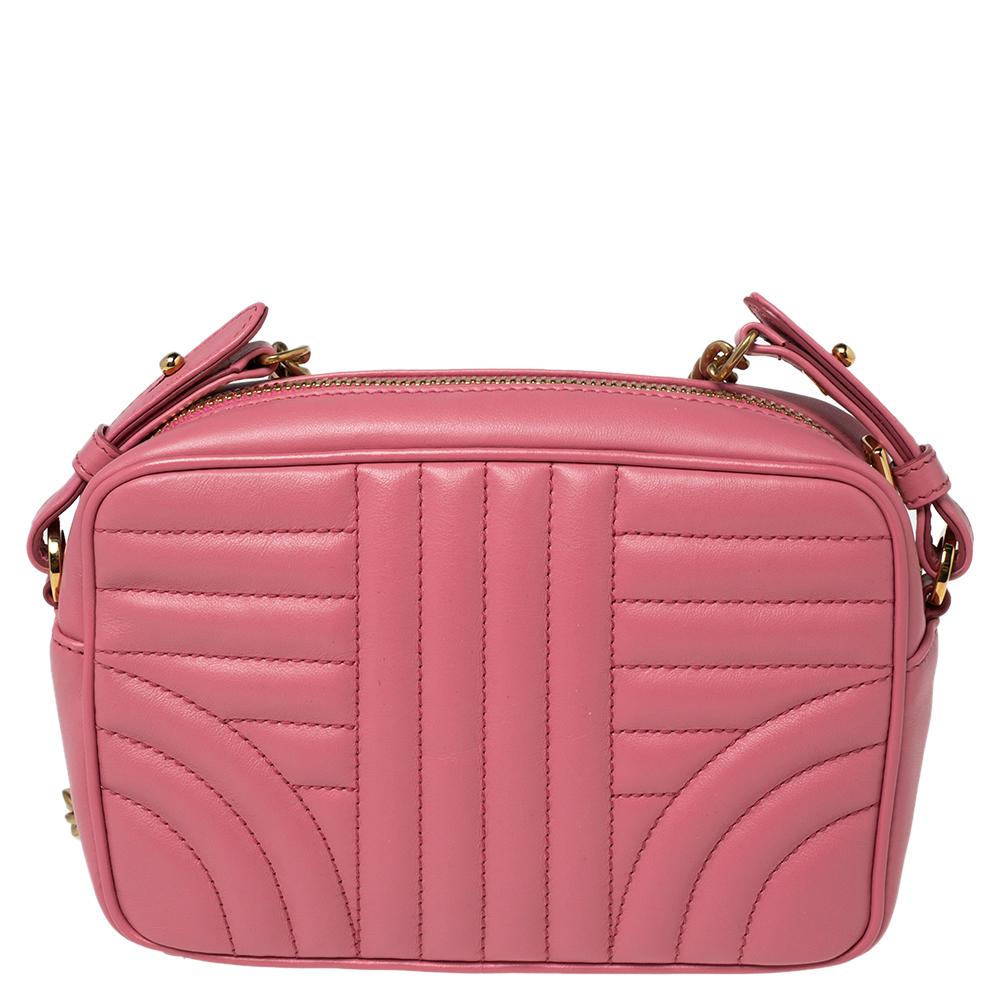 Bags are more than just instruments to carry one's essentials. They tell a woman's sense of style and the better the bag, the more confidence she gets when she holds it. Prada brings you one such fabulous bag meticulously made from pink Diagramme