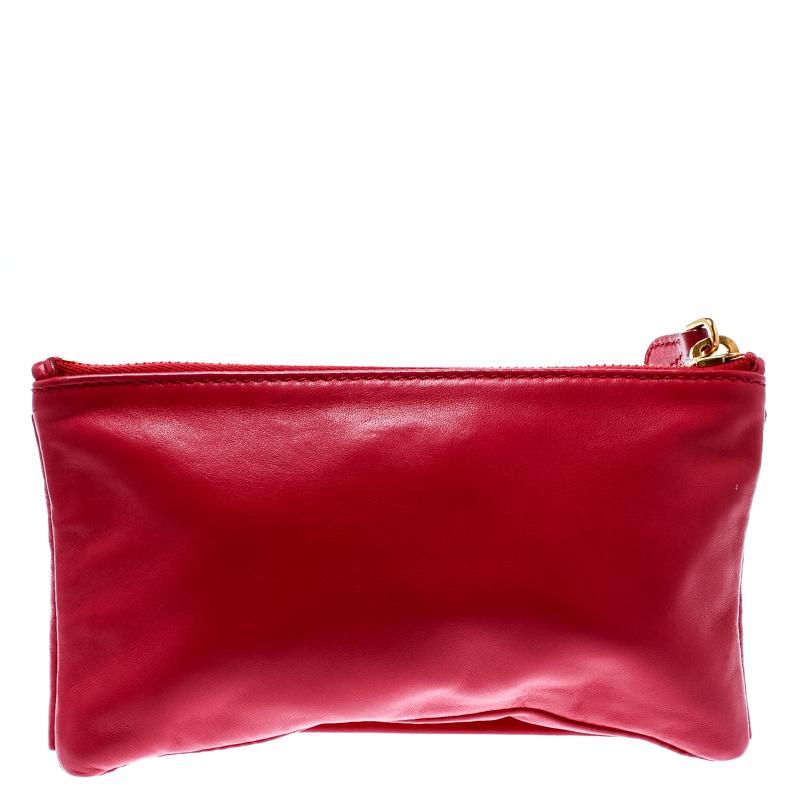 This Prada clutch was created to please. Crafted from pink leather, it has two pretty rose appliques and the logo on the front. The nylon-lined interior will house your little essentials with ease.

Includes: The Luxury Closet Packaging

