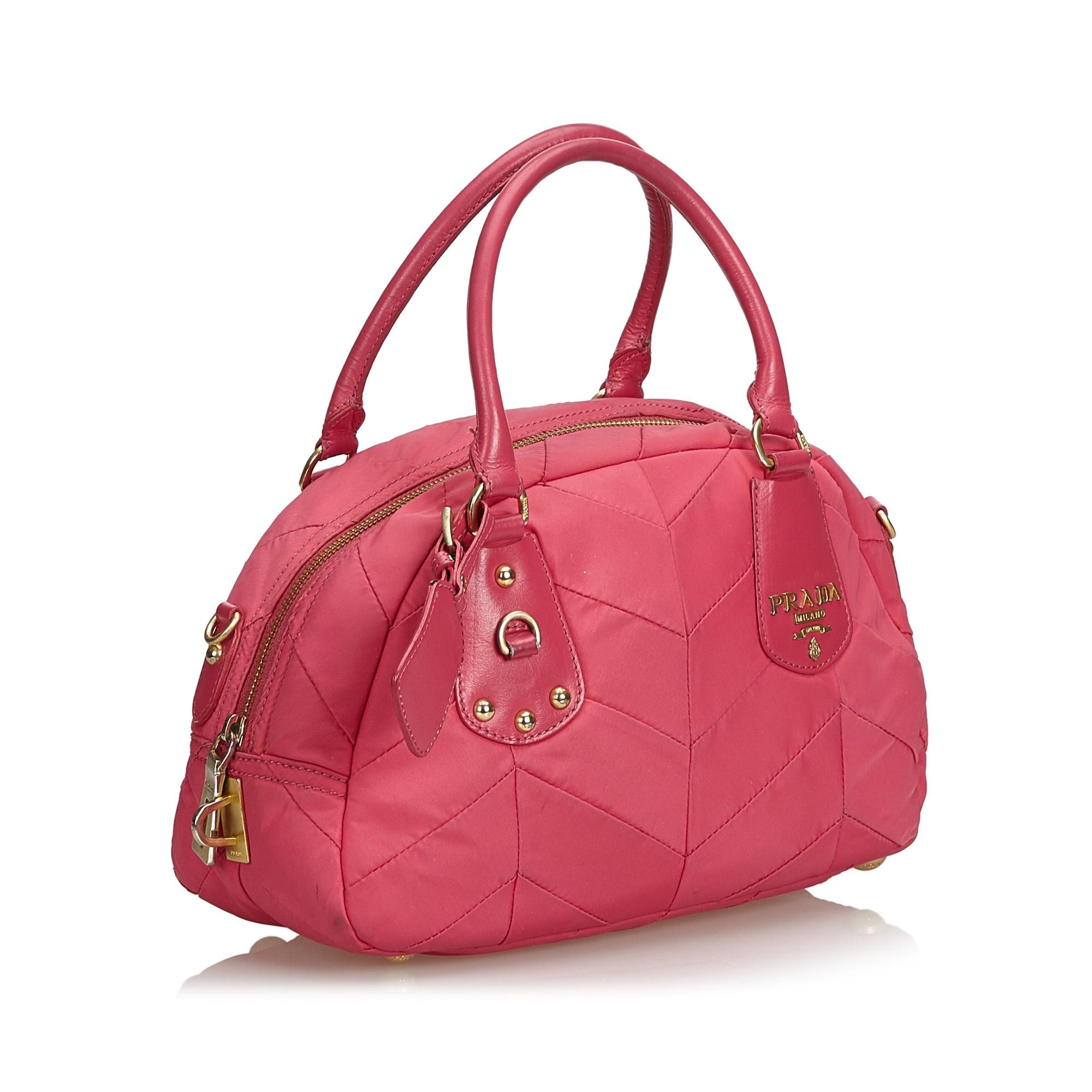This handbag features a quilted nylon body, rolled leather handles, a top zip closure, and interior zip and slip pockets. It carries as B+ condition rating.

Inclusions: 
This item does not come with inclusions.

Dimensions:
Length: 19.00 cm
Width: