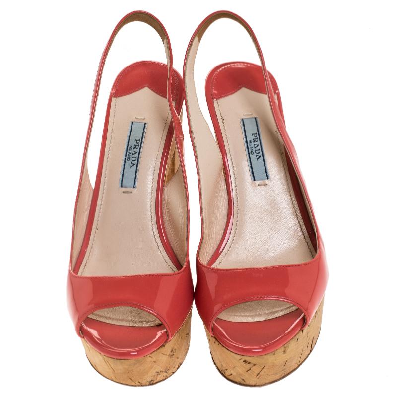 These pink sandals from Prada definitely need to be on your wishlist! They are crafted from patent leather and feature a peep-toe silhouette. They flaunt slingback straps and come equipped with cork platforms and 12 cm block heels. Grab them right