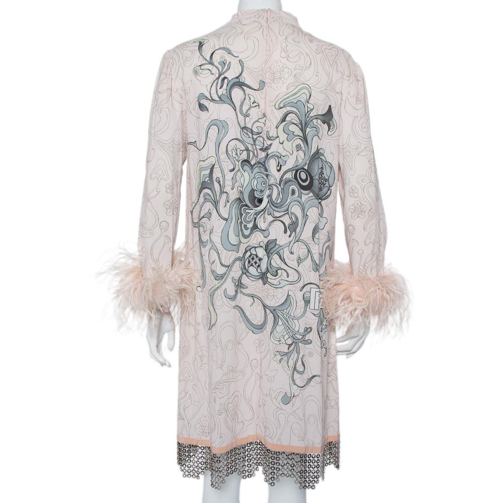 Stylish and perfect for sophisticated soirees, this shift dress by Prada in pink is a must-have. It has been crafted from printed crepe and comes with a metal-detailed hemline and feather detailing on the sleeves. it is secured with a zip closure.

