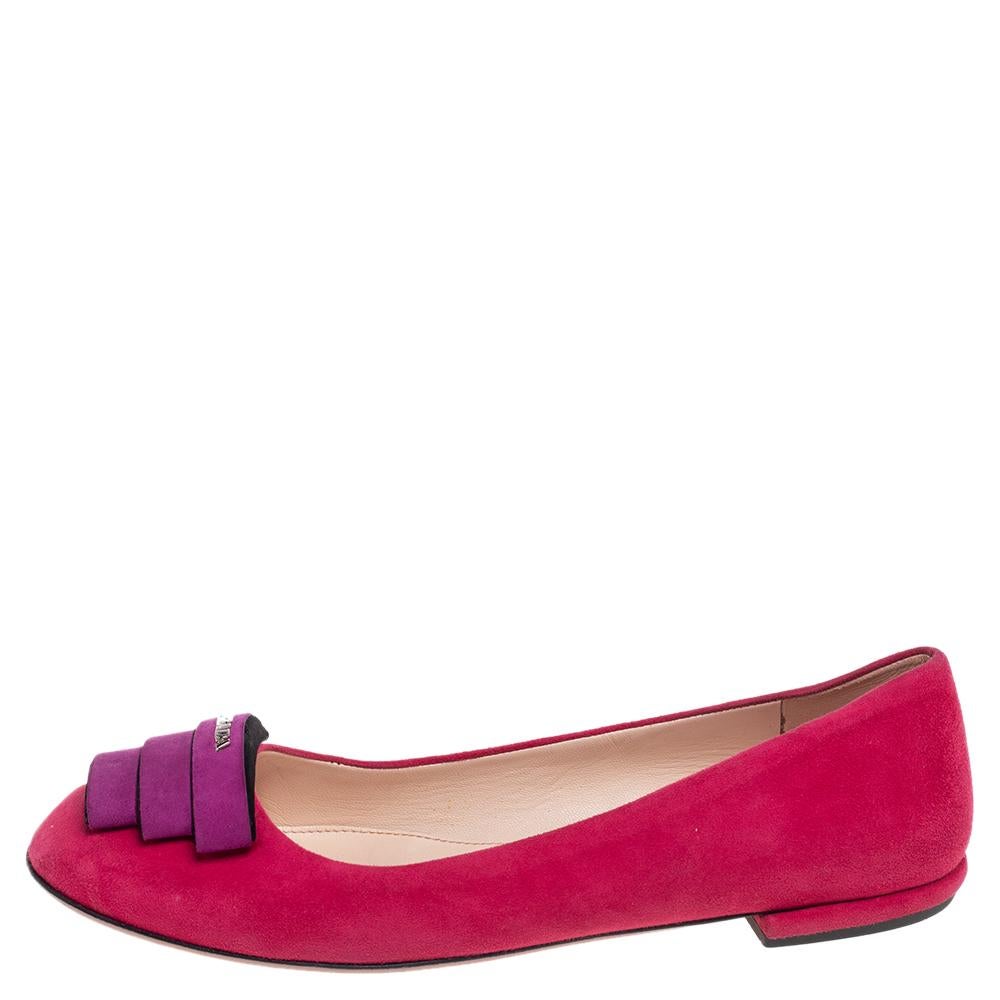Brighten up your monotonous outfit by wearing these cool flats from Prada. They are skillfully made using pink-purple suede with a silver-toned logo attached to the front. As these flats are made in an effortless slip-on style, they are easy to use