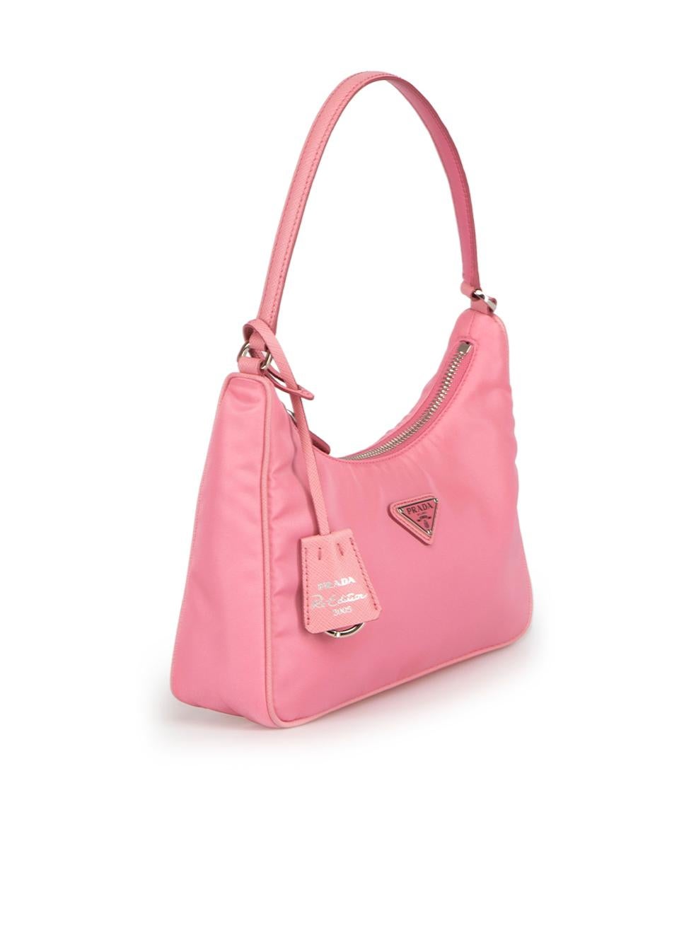 CONDITION is Very good. Minimal wear to bag is evident. Minimal wear to the piped trim with light marks to the leather on this used Prada designer resale item.
 
Details
Re-Edition 2005
Pink
Nylon
Mini shoulder bag
1x Leather strap
1x Main zipped