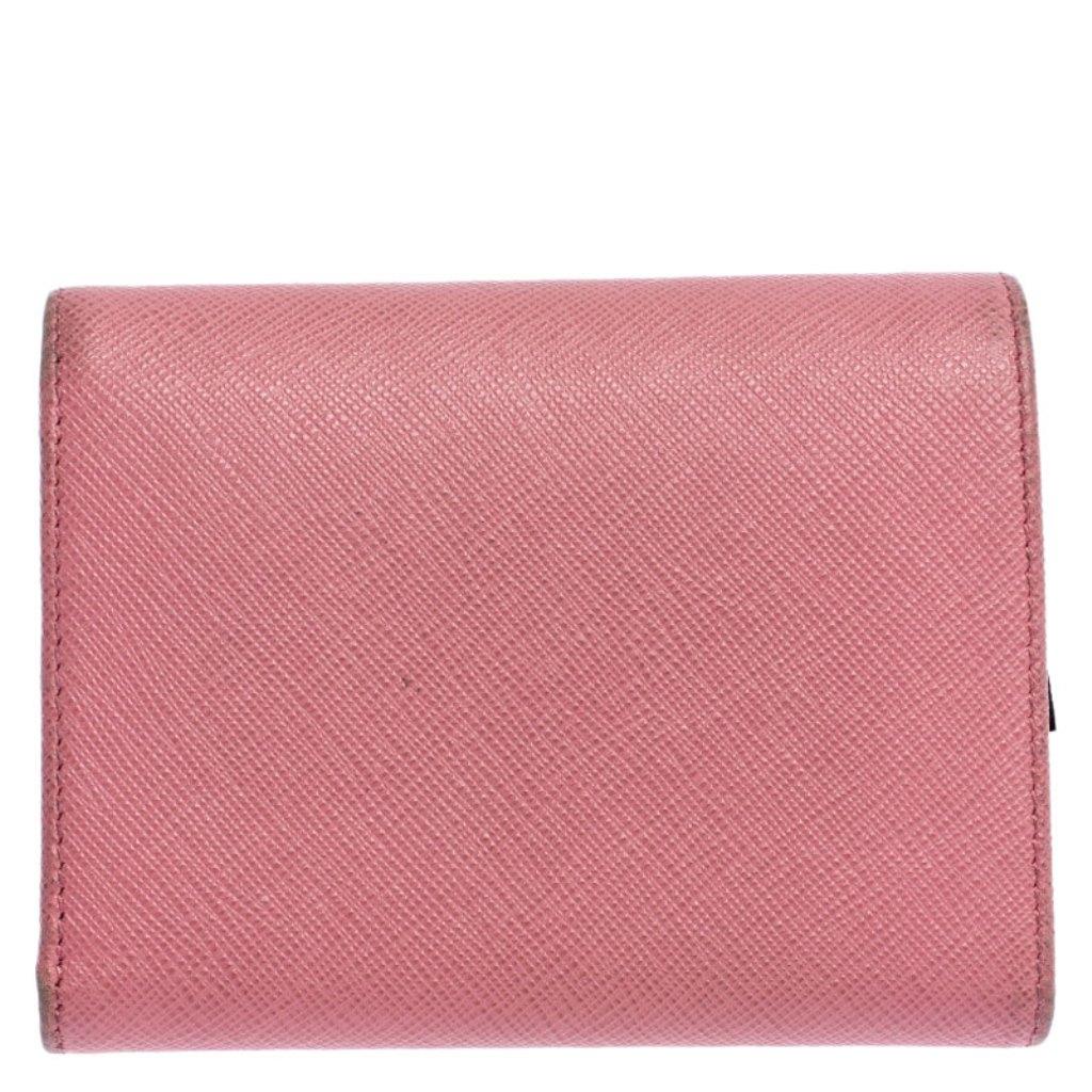 Designed to perfection and crafted from fine quality leather, this wallet can be your go-to accessory. This wallet is a suave creation from the house of Prada. The rich pink hue of this stylish wallet adds to the overall appeal.

Includes: