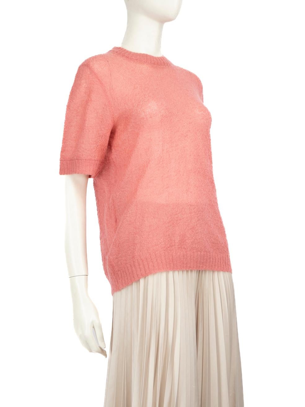 CONDITION is Very good. Hardly any visible wear to top is evident on this used Prada designer resale item. The brand label has been partly detached on one side.
 
 
 
 Details
 
 
 Pink
 
 Wool
 
 Knit top
 
 Short sleeves
 
 Stretchy
 
 See-