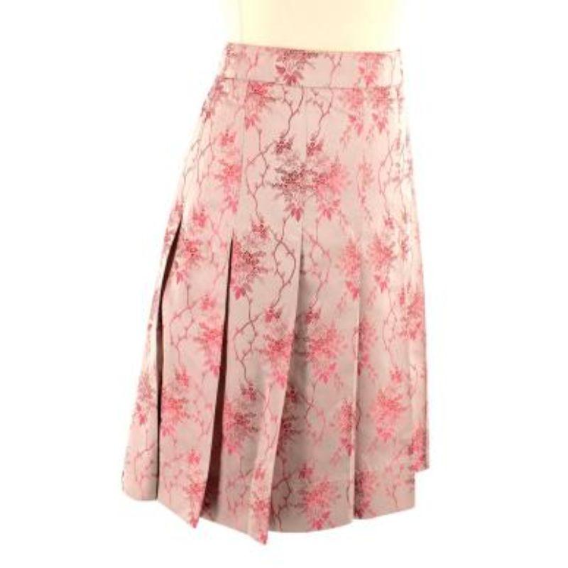 Prada Pink Patterned Pleated Skirt

- Concealed zip fastening
- Embroidery pattern throughout
- High-waisted
- Mid-thigh length
- Pleated throughout

Material
There is no care label but we believe it to be a woven silk blend

Made in Italy

PLEASE