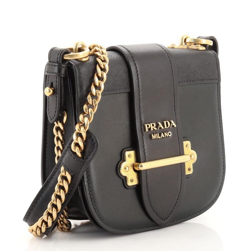 Condition: Fair. Creasing, wear, heavy scuffs on exterior and underneath flap, oil slick discoloration on rear, base and front underneath flap. Creasing and wear on shoulder pad, minor splitting on flap opening corner wax edges. Scuffs and wear in