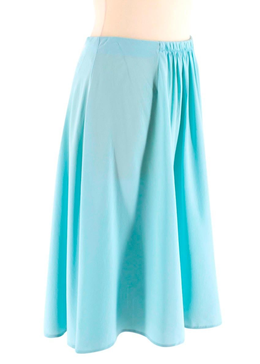 Prada Light Turquoise Silk Skirt

- High waist 
- Gathered front detail
- Concealed side hook/zip fastening
- Mid-length
- Lightweight

Material
- 100% silk
- Dry clean only

Made in China

Measurements are taken laying flat, seam to seam. 

Waist: