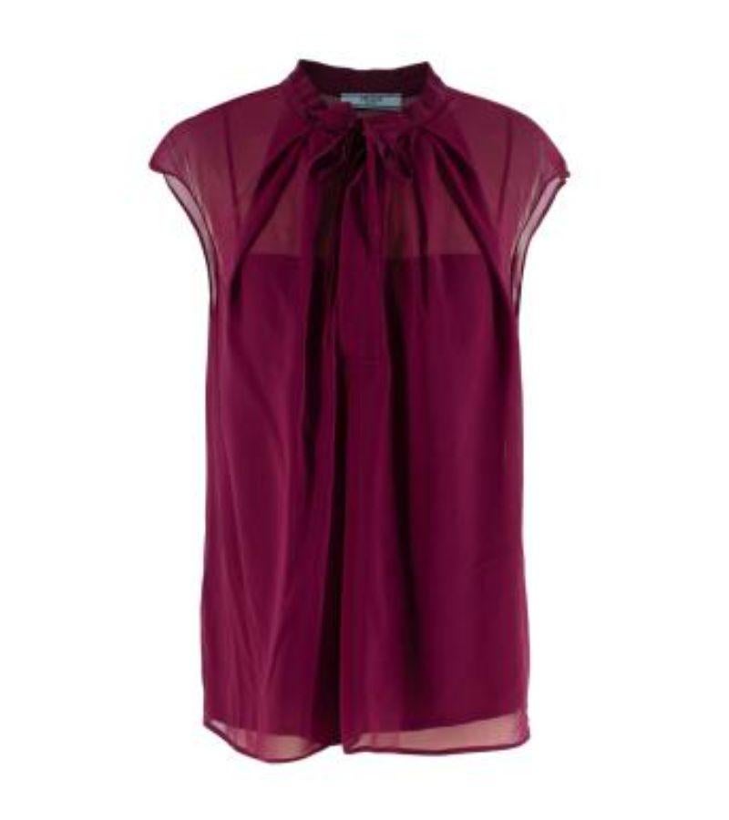 Prada Plum Silk Chiffon Lavaliere Sleeveless Blouse

- Fine silk chiffon, with a tonal slip
- Self-tie lavaliere collar
-  Concealed buttons at chest 

Materials 
100% Silk 

Made In Italy 
Dry Clean Only 

9.5 excellent condition 

PLEASE NOTE,