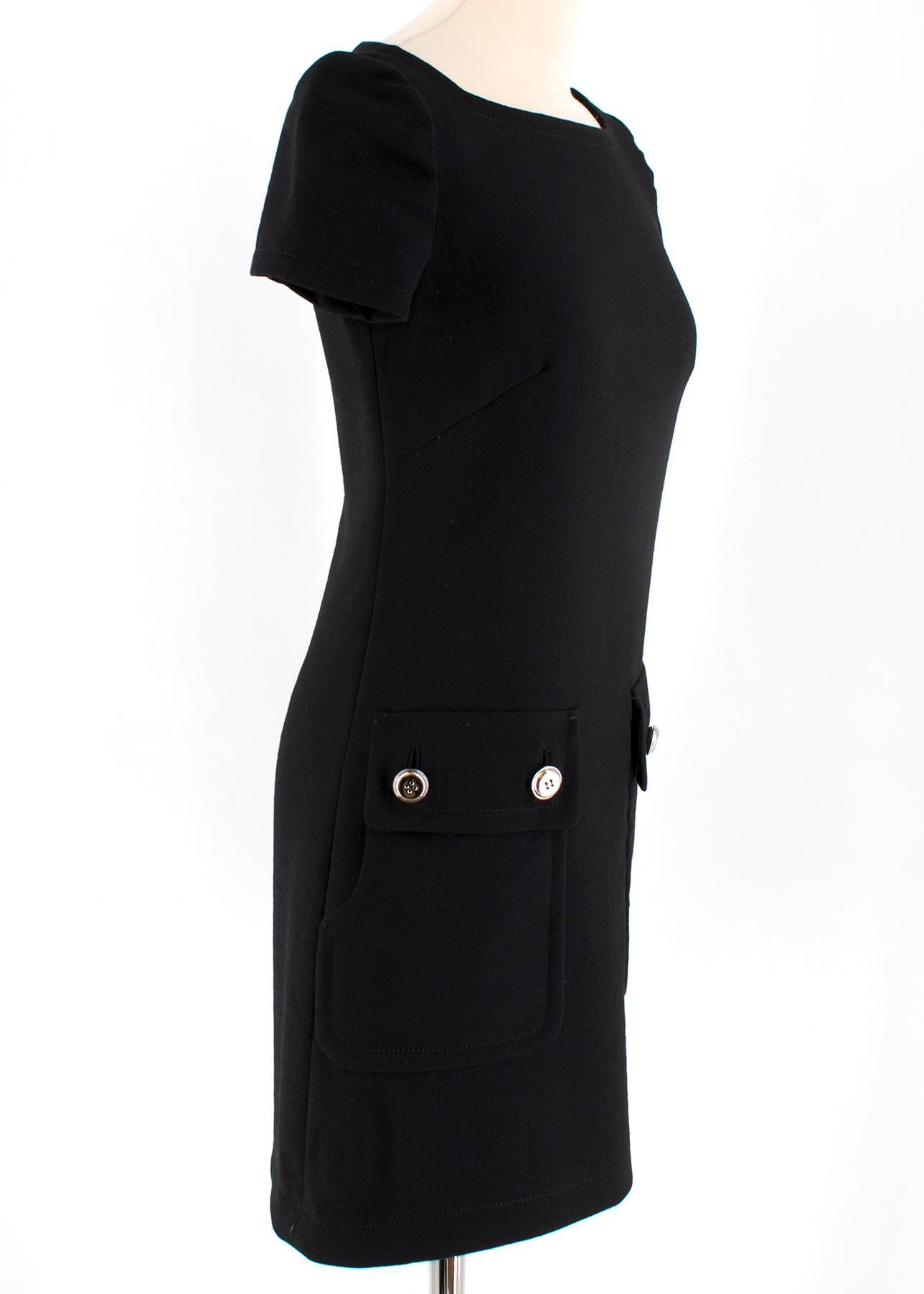 Prada Pocket Detail Wool Black Dress

Dart Stitches at the Bust
Slight Puffed Short Sleeves
Low Front Pockets With Double Silver Buttons
Black Hardware 
Back Zipper
Black Lining


Please note, these items are pre-owned and may show some signs of