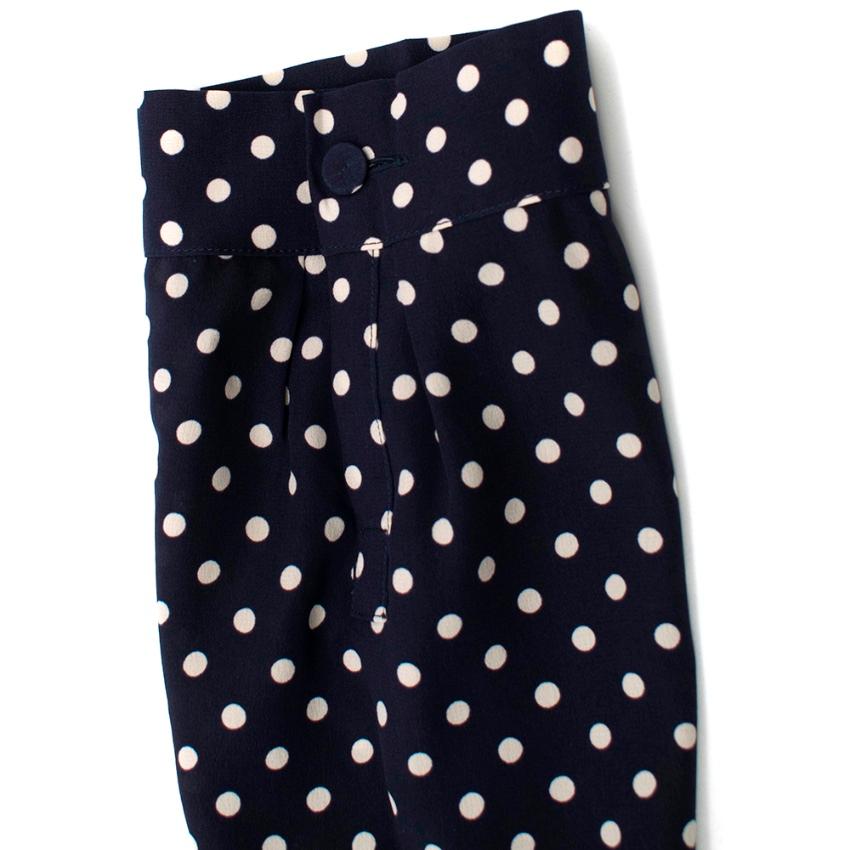 Prada Polka Dot Navy Silk Swing Dress

- Pleated Lower skirt 
- Rounded Neckline 
- Mid-Length sleeve with button detail at cuff 
- Back Central Invisible Zip closure 

Materials 
100% Silk 

Dry Clean Only 

Made in Italy 

Measurements are taken